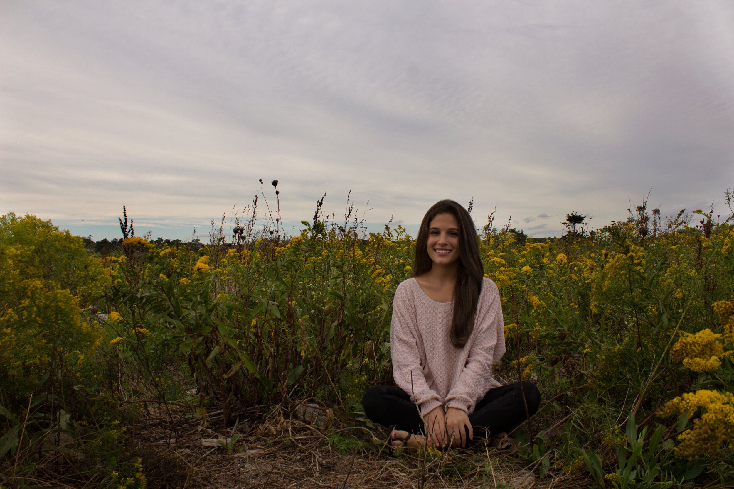 meg-sitting-in-flowers.jpg