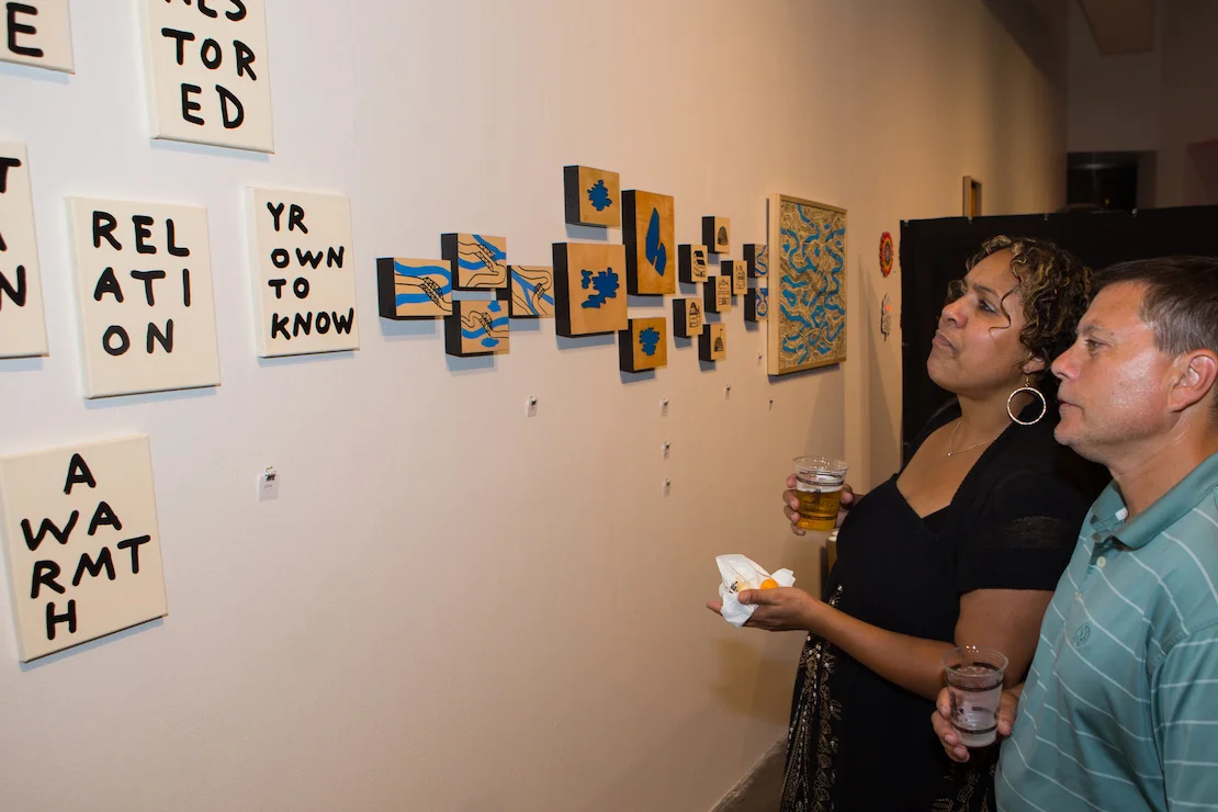 Attendees admire works by Pittsburgh artist, Seth LeDonne (CSA PGH 2017 Artist).