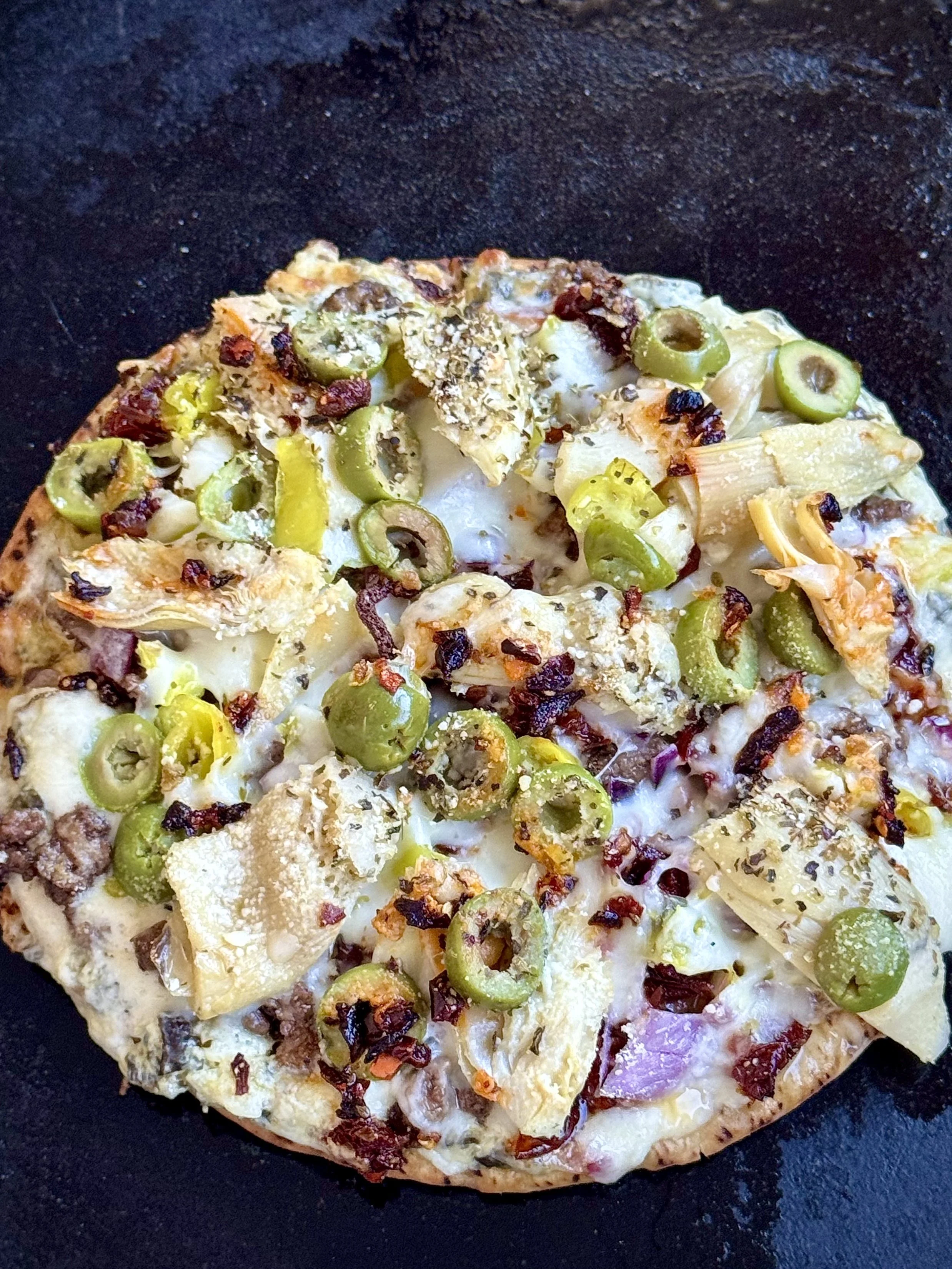 Greek-style lamb and artichoke pita pizza.