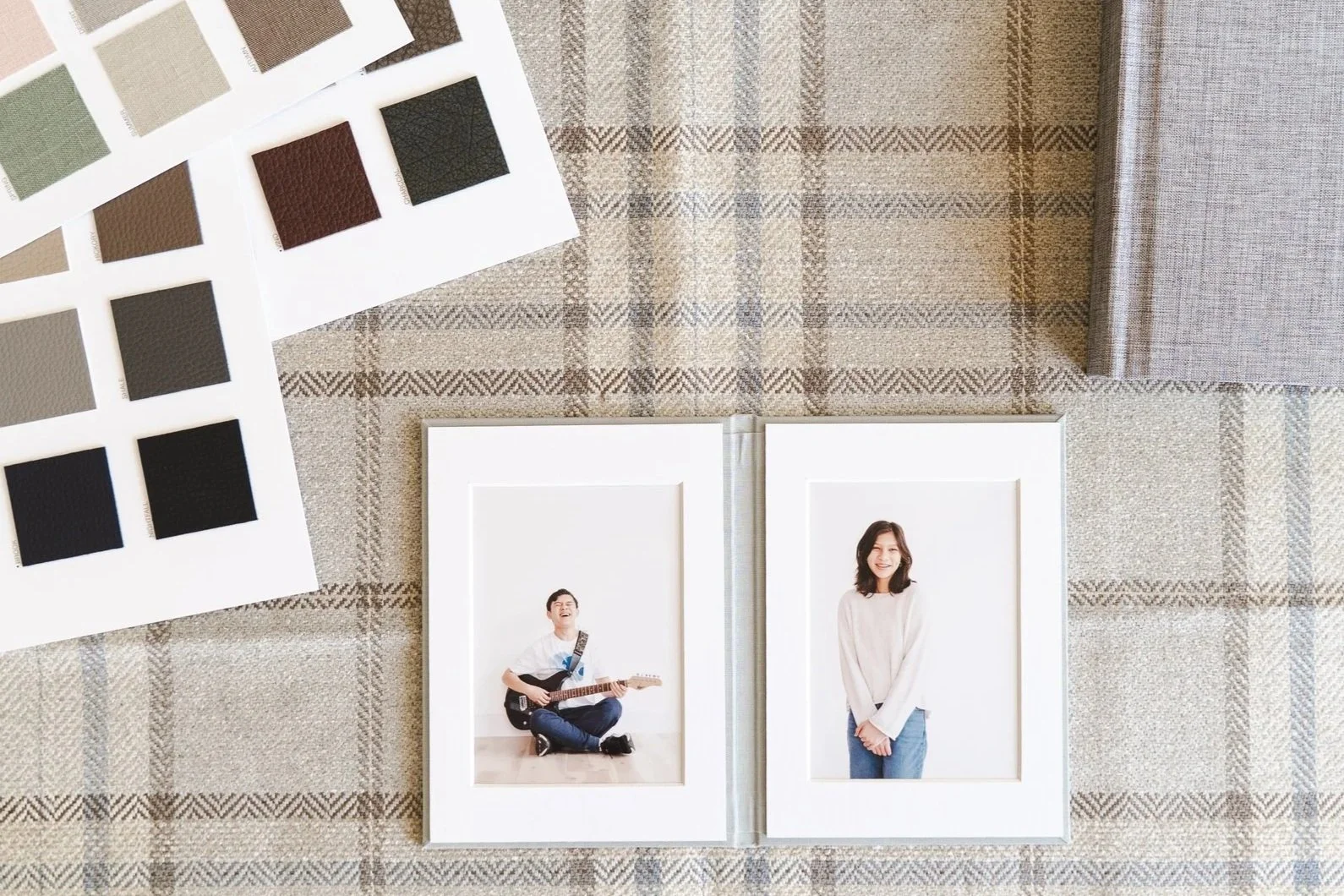 Flatlay of an image folio and cover swatches.