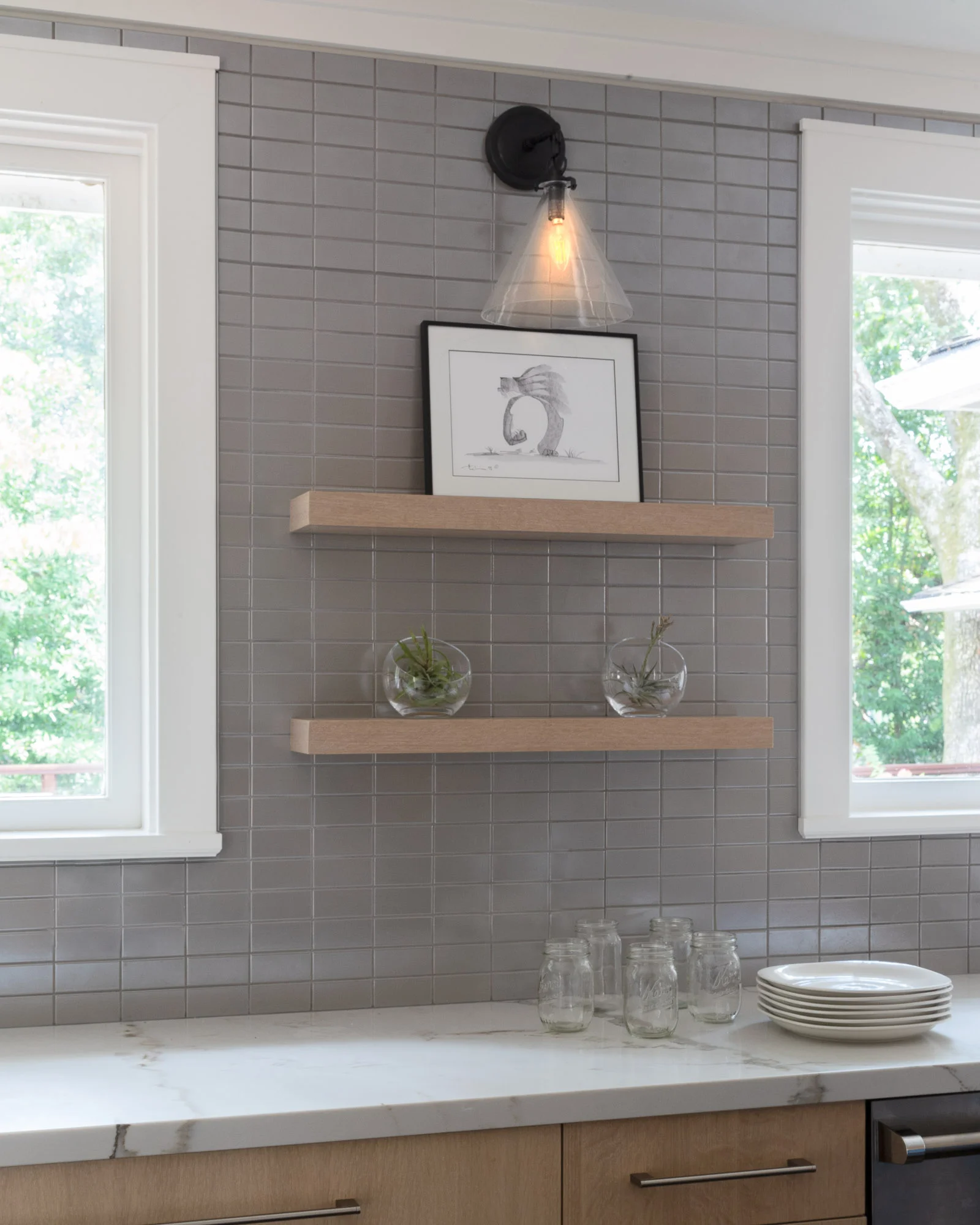 Floating shelves on Ann Sacks grey shimmer tile in a Lafayette, CA contemporary kitchen