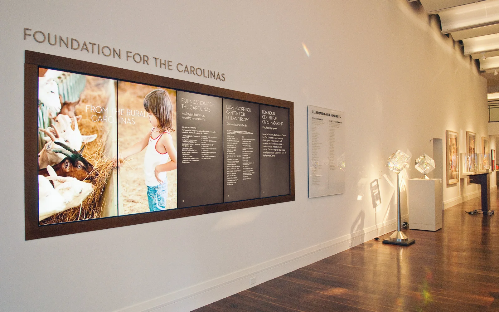        We created several large digital displays that cycle through donor and trustee credits, photographic slideshows, and event and boardroom scheduling information. We also developed an interactive touchscreen kiosk, found at several locations thr