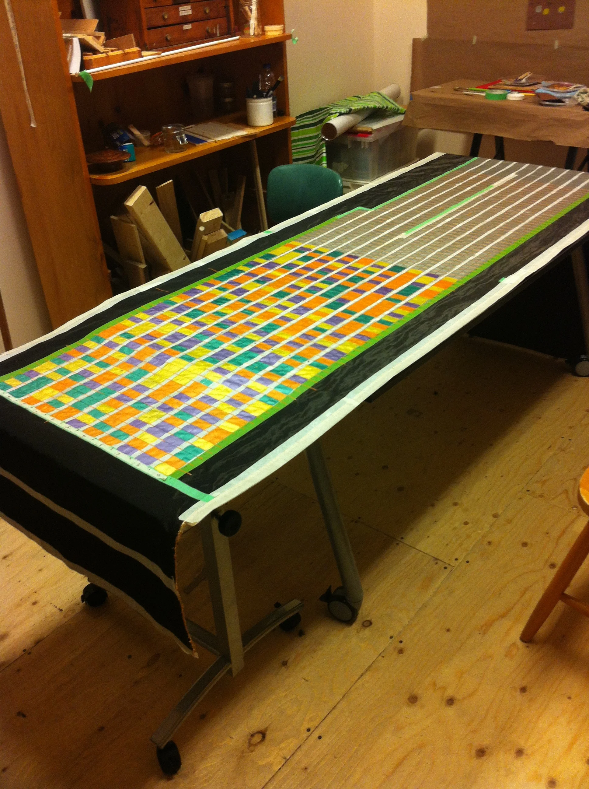  There are over 4000 little squares. Each square has 2 layers of silver paint and 3 layers of coloured paint. 