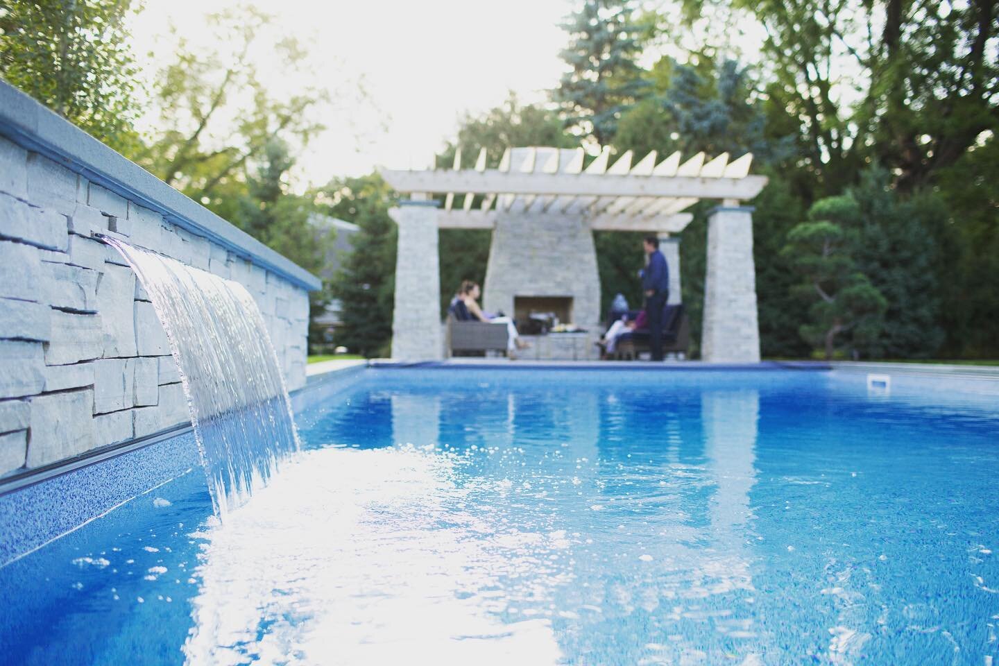 Water, fire, nature, friends &amp; family. All the good things 💚 #outdoorlivingspaces #pergola #outdoorfireplace #poolsofinstagram #thegreatexcape #landscapedesignbuild #landscapedetails