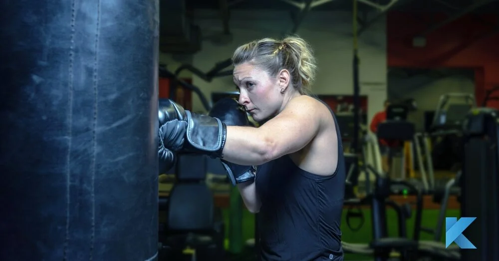 2019 2 6 girl boxing on punching bag klub athletik gym-min.jpg