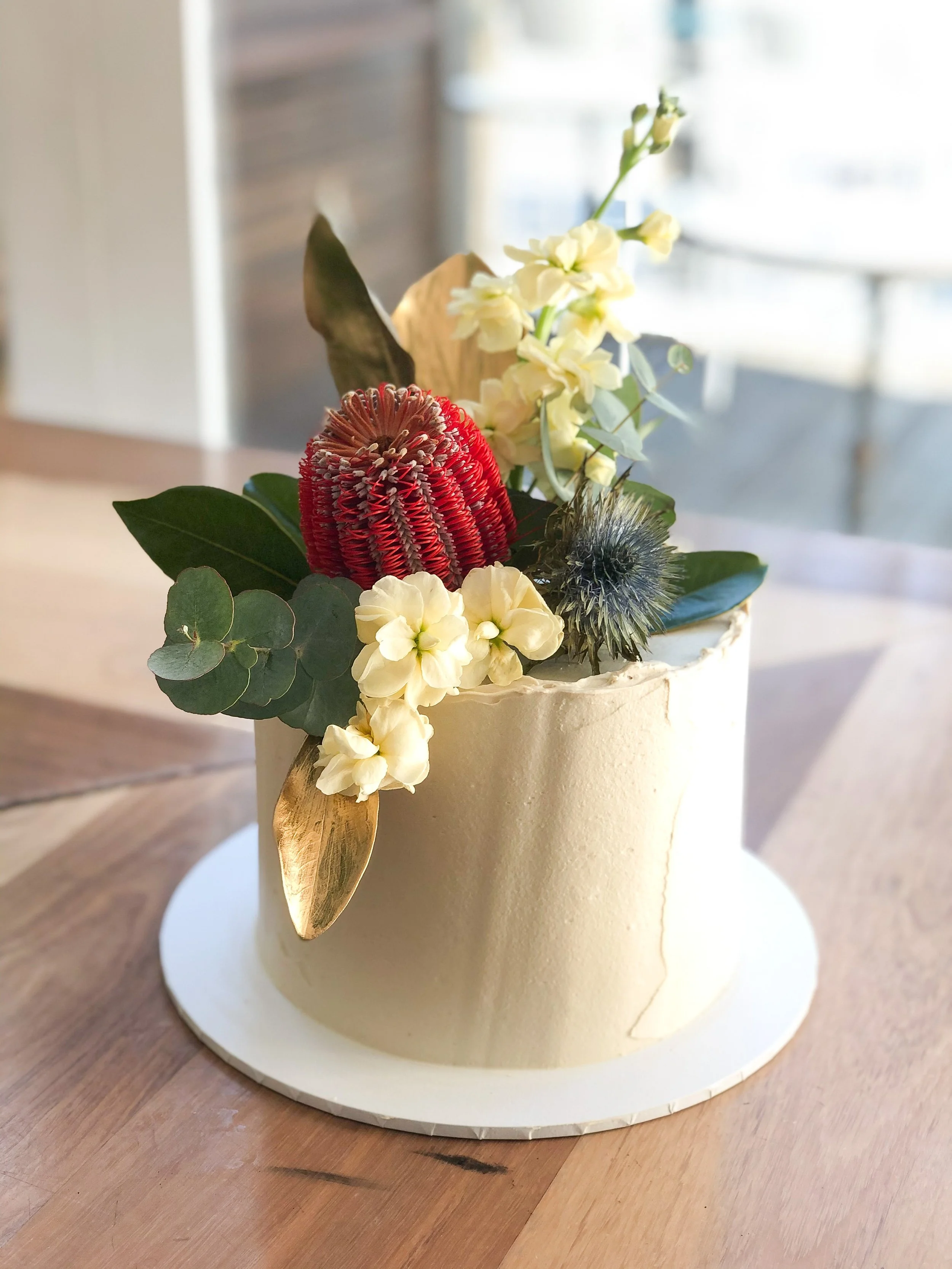 Birthday cake with natives & gold foliage
