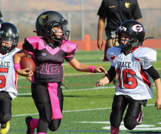 pink and black football jersey