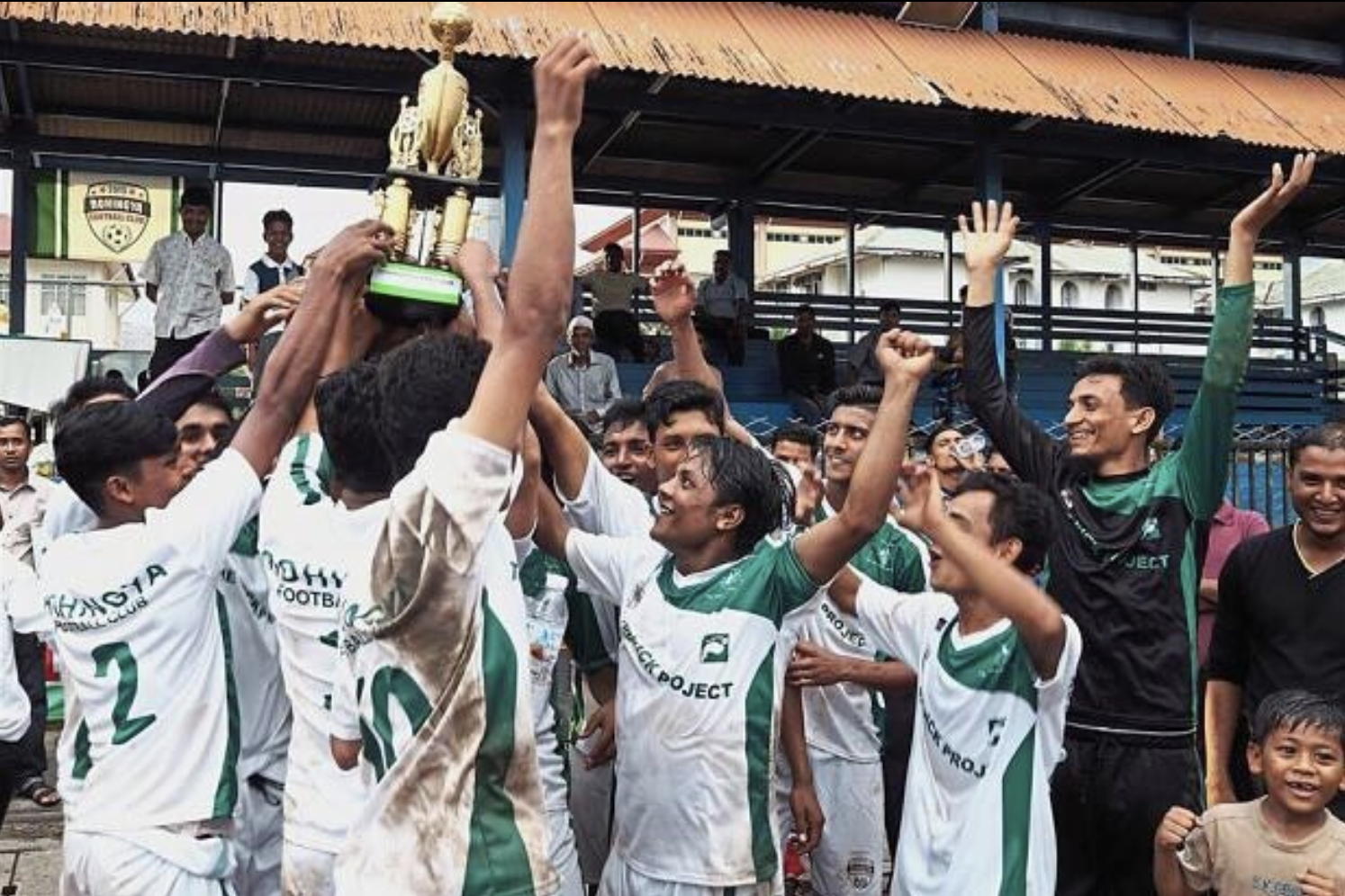Sporting the custom made green and white uniforms made by Wooter Apparel, the Rohingya Football Club celebrates another victory competing in Malaysia's Kick Project.