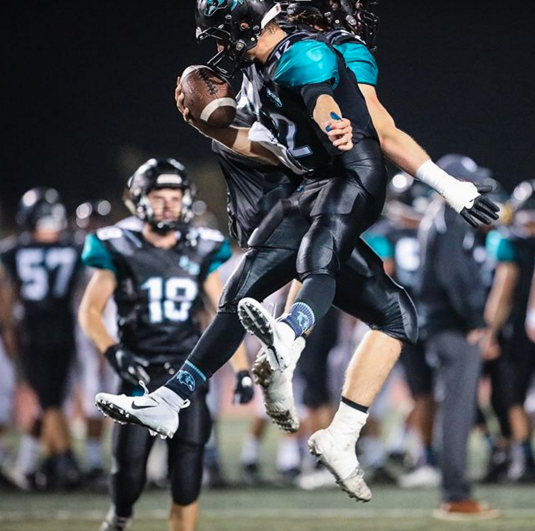 Each year Wooter Apparel works with a number of high school football teams around the US to customize their gear for the season. This year we are proud to cheer on Aliso Niguel High School in Aliso Viejo, California, with the Wolverines donning the teal and black from Wooter Apparel this Fall.