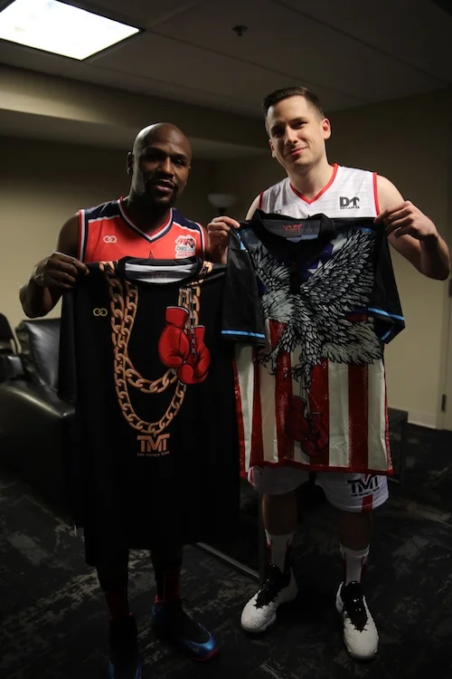 The Champ Is Here: Alex Aleksandrovski, Co-Founder and CEO of Wooter, presents Floyd Mayweather with some customized TMT merch from Wooter Apparel.