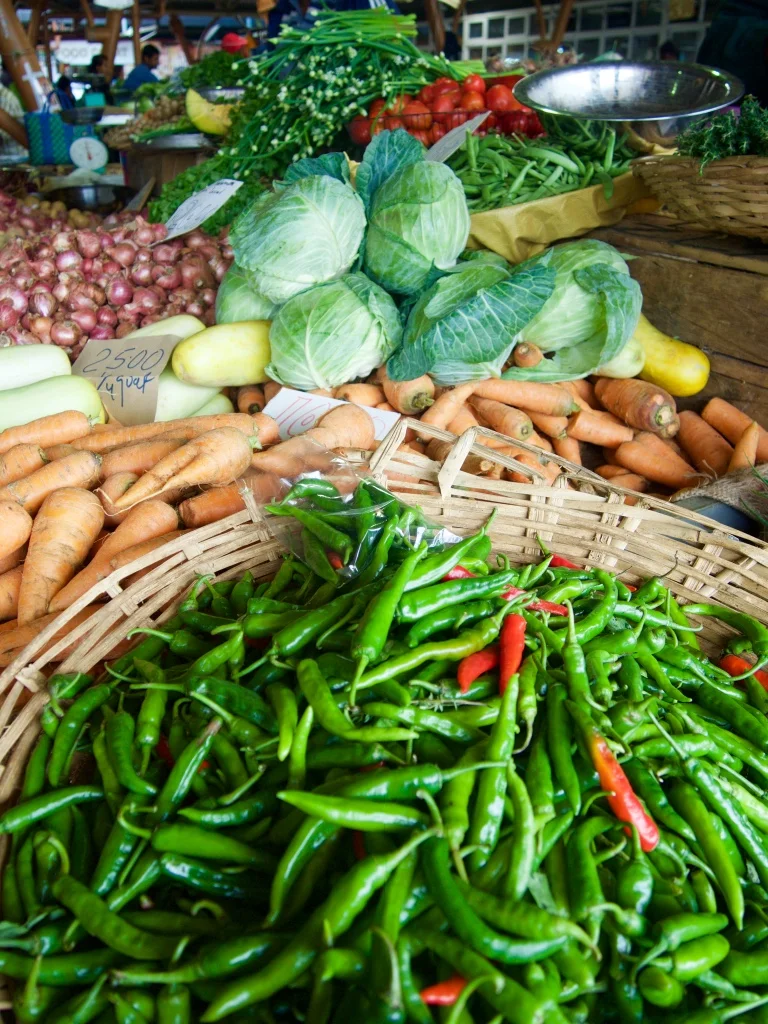 Fresh vegetables and hot chilis for sale beckon shoppers at the Wednesday market in Flacq - one of the largest on the island.