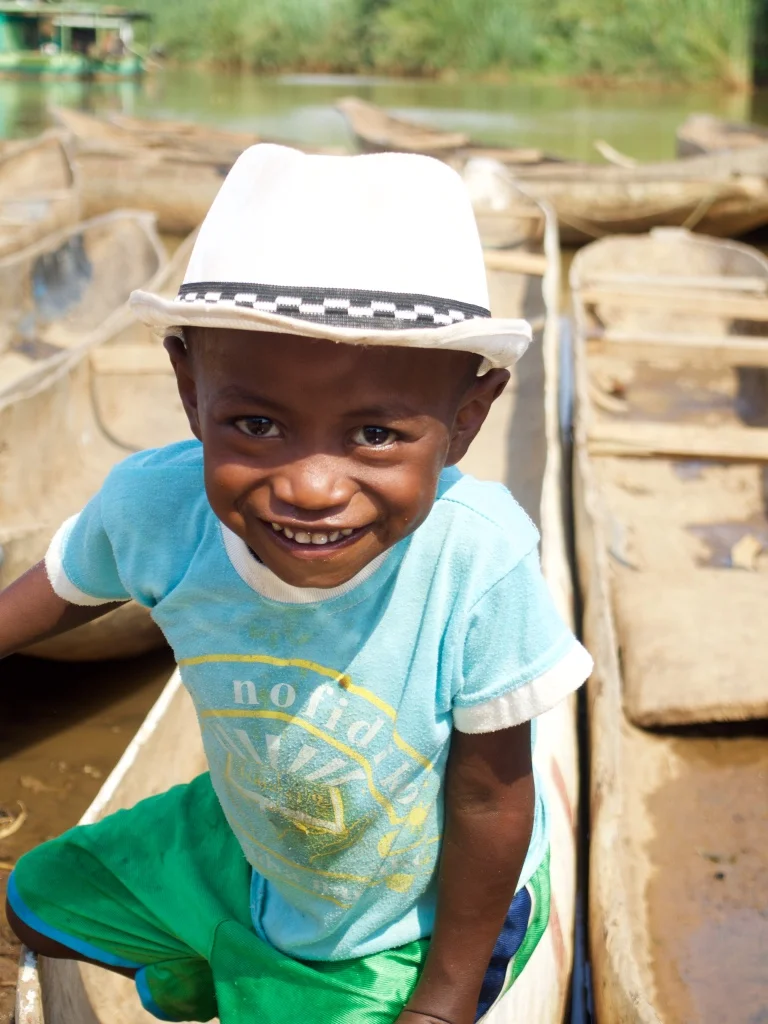 A little man with a big smile. Families are big here and Madagascar has one of the youngest populations in the world. Lots of kids in every village.&nbsp;