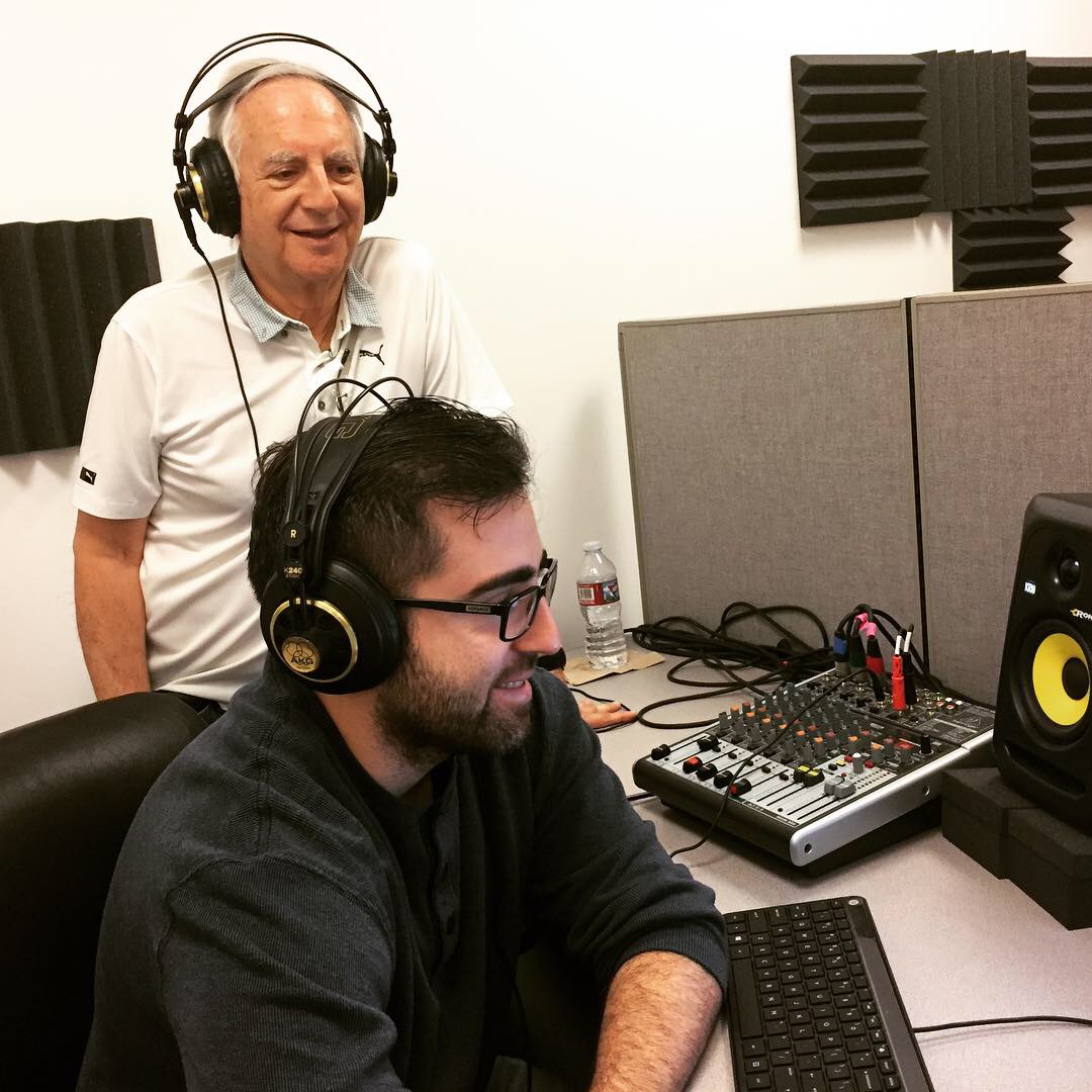 Caption: Father-son duo, Ron and Max Cutler, recording an episode of Remarkable Lives Tragic Deaths