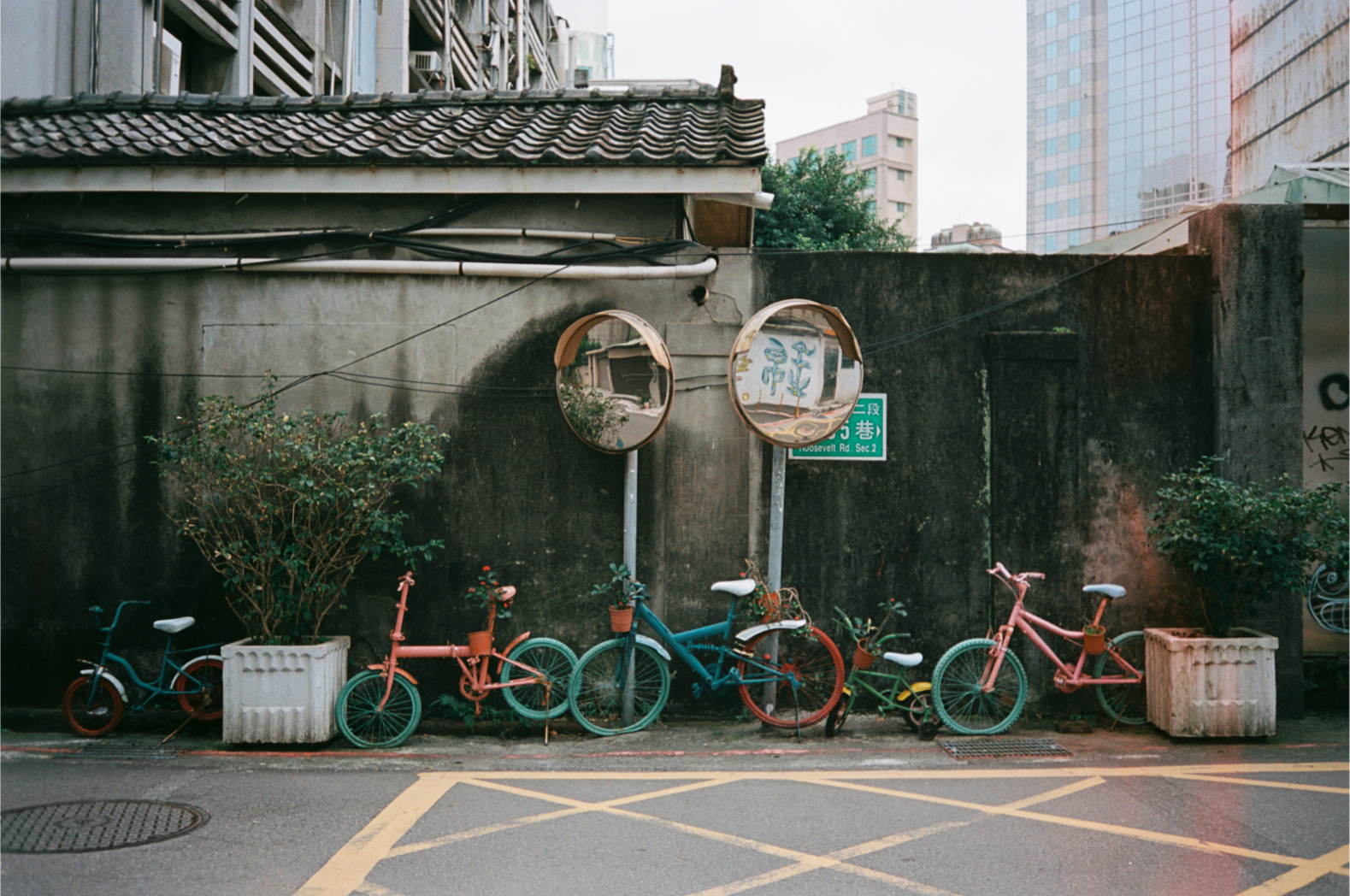 multiple bicycles in taipei on a side street