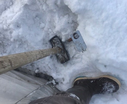  Snow is as insulator….there were some frozen spots, but rebar pounded in, though we had to dig out around each ground post in order to fit the metal ribs on and let them reach the ground (or close to it).  