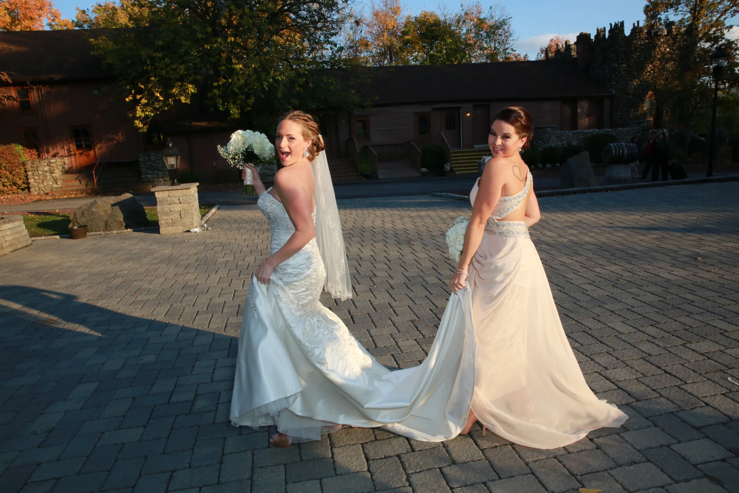 Bride and maid of honor posing for a fun picture