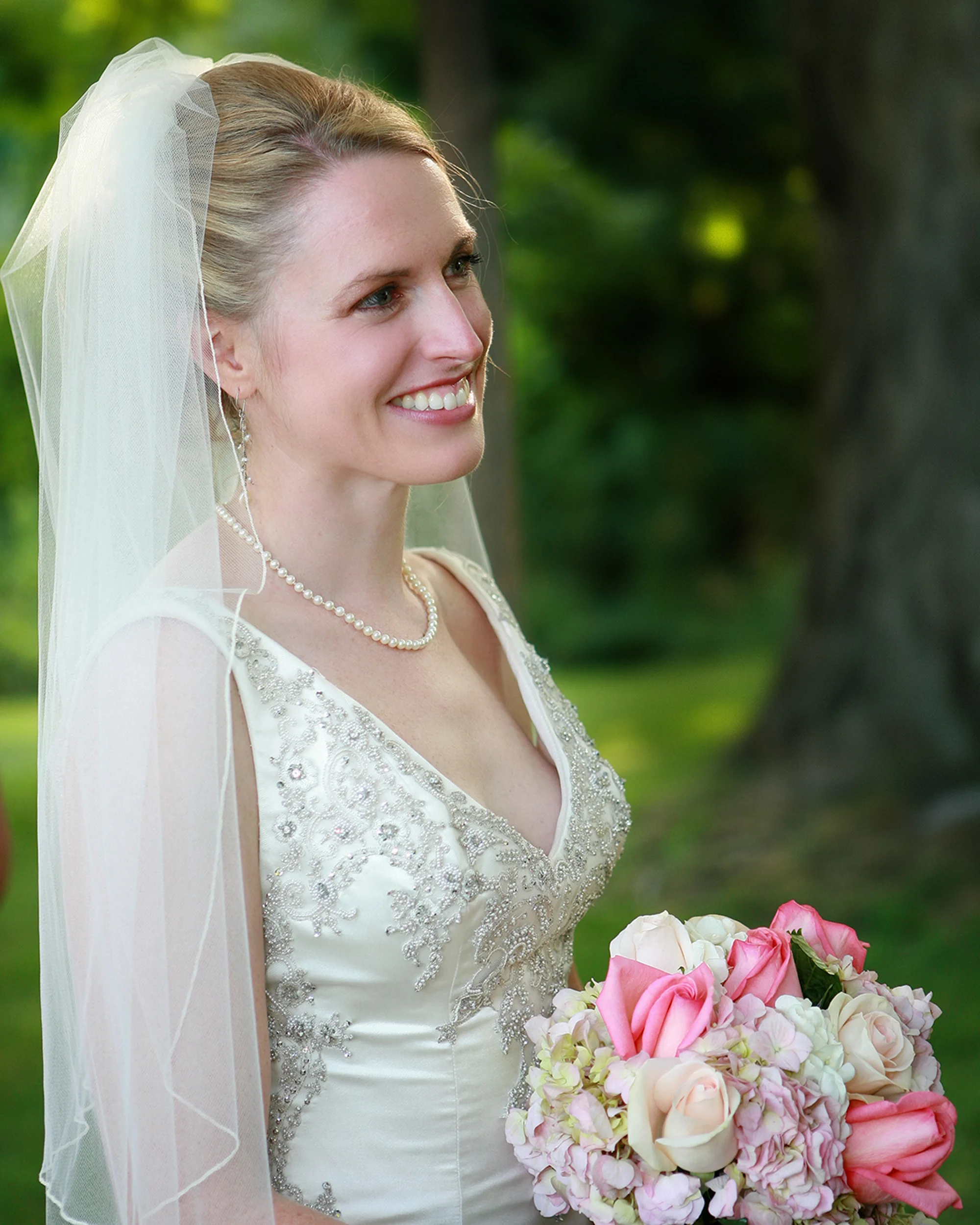 bride with lovely pink flowers