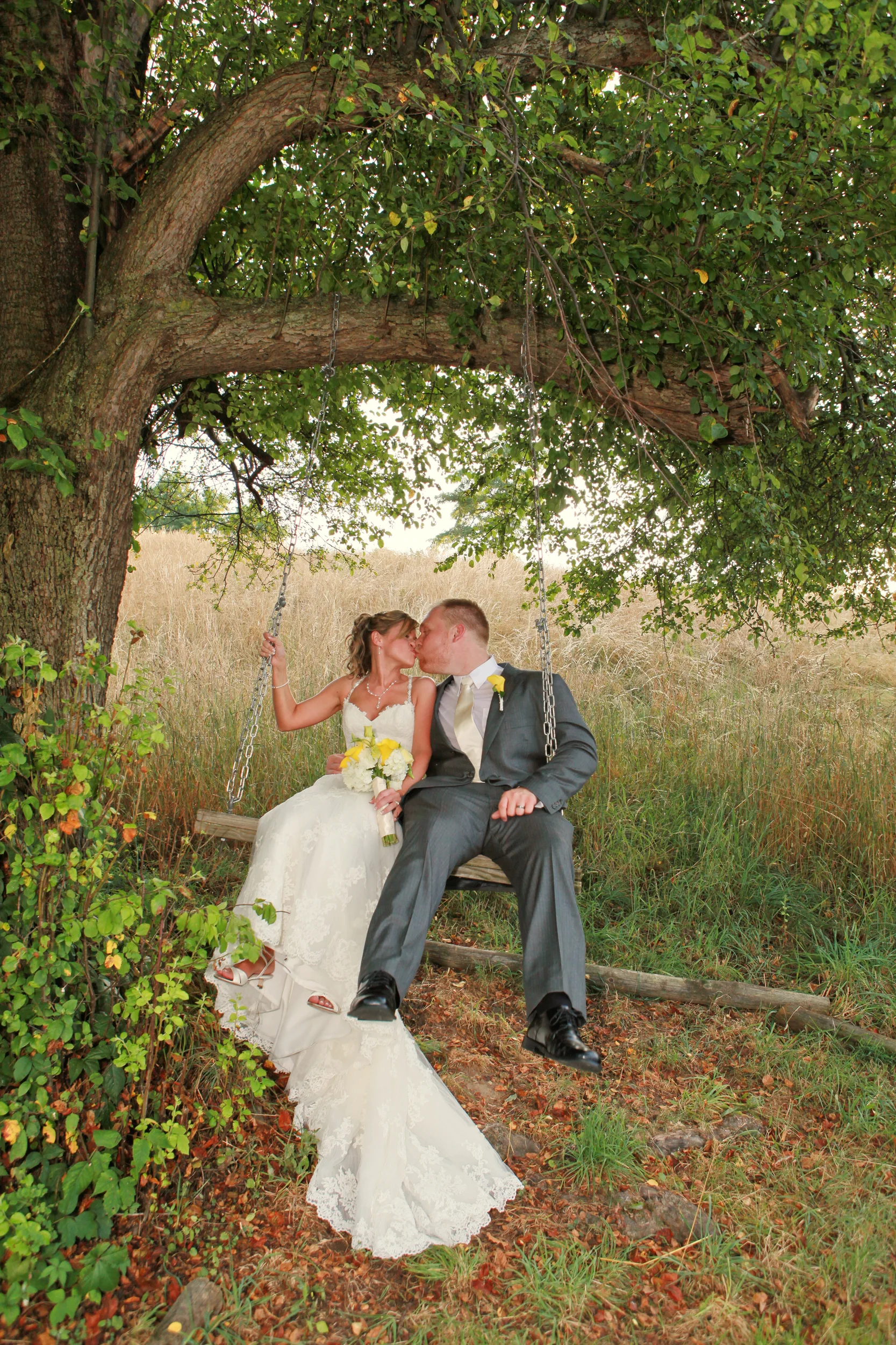 Bride and Groom at swing set at Hudson Valley Winery