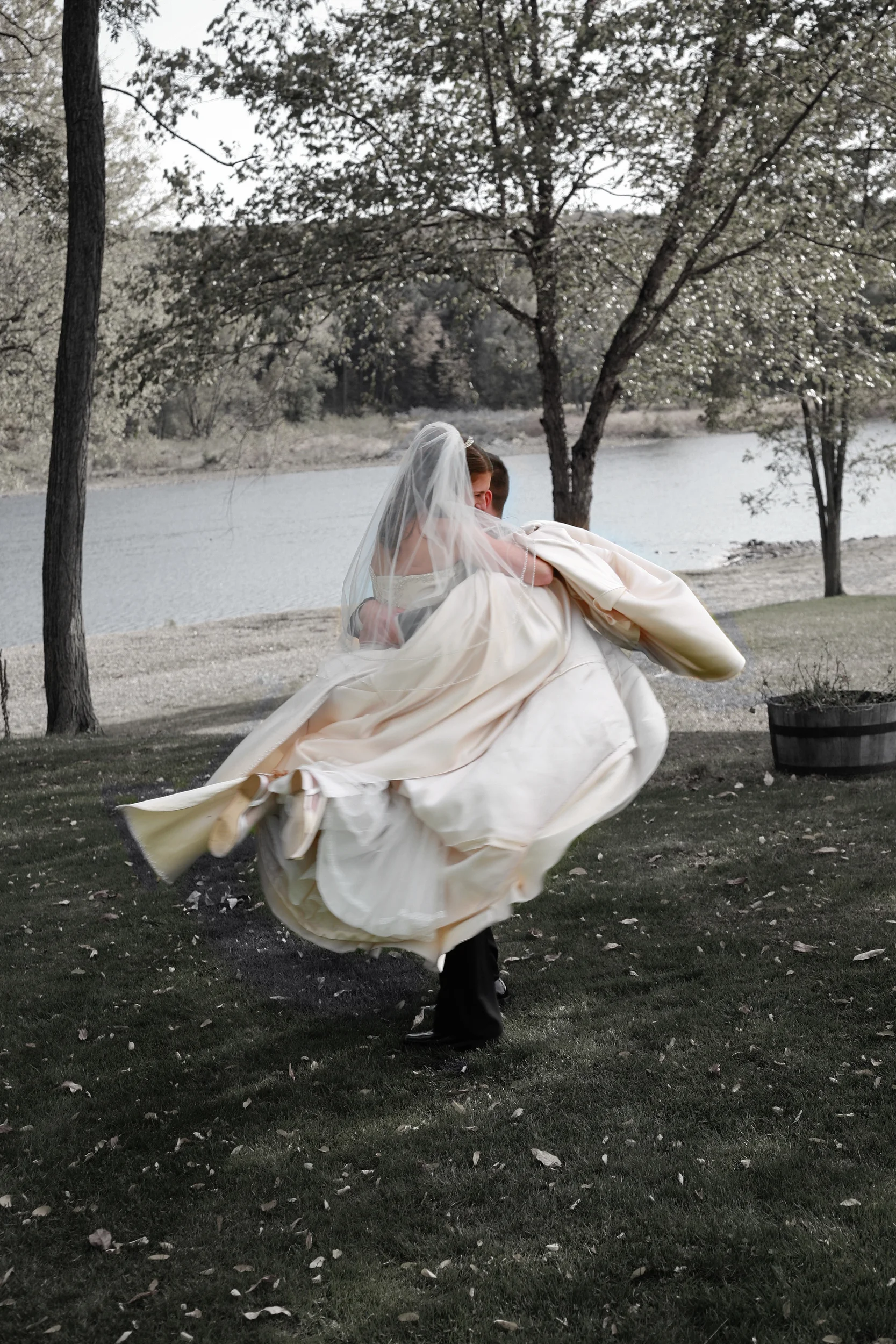 Groom spinning bride around