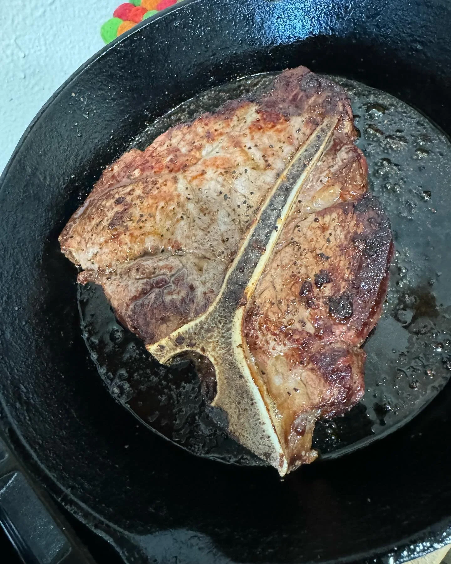 Bought this beautiful #tbone and had to cook it up before it went to waste. Delicious #broiled steak w. #boiled #redfingerlingpotatoes and #sauteedarugula saut&eacute;ed  #garlic and #onions!!!