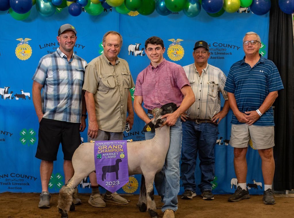  Cade Weber, Grand Champion Lamb, purchased by Cox Farm, Raschein Tangent, Riverland Ranch LLC &amp; Steve Carothers 