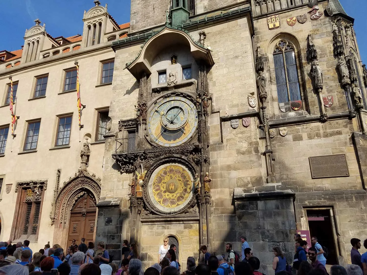 This is one of Prague's most famous landmarks - the top astrological clock dates to 1410. Every hour, the two little blue windows above the clock open up and these little wooden saints march across the open windows on a carousel, and every hour dozens or hundreds of people gather to watch and take photos. I mean, people get really excited about this.