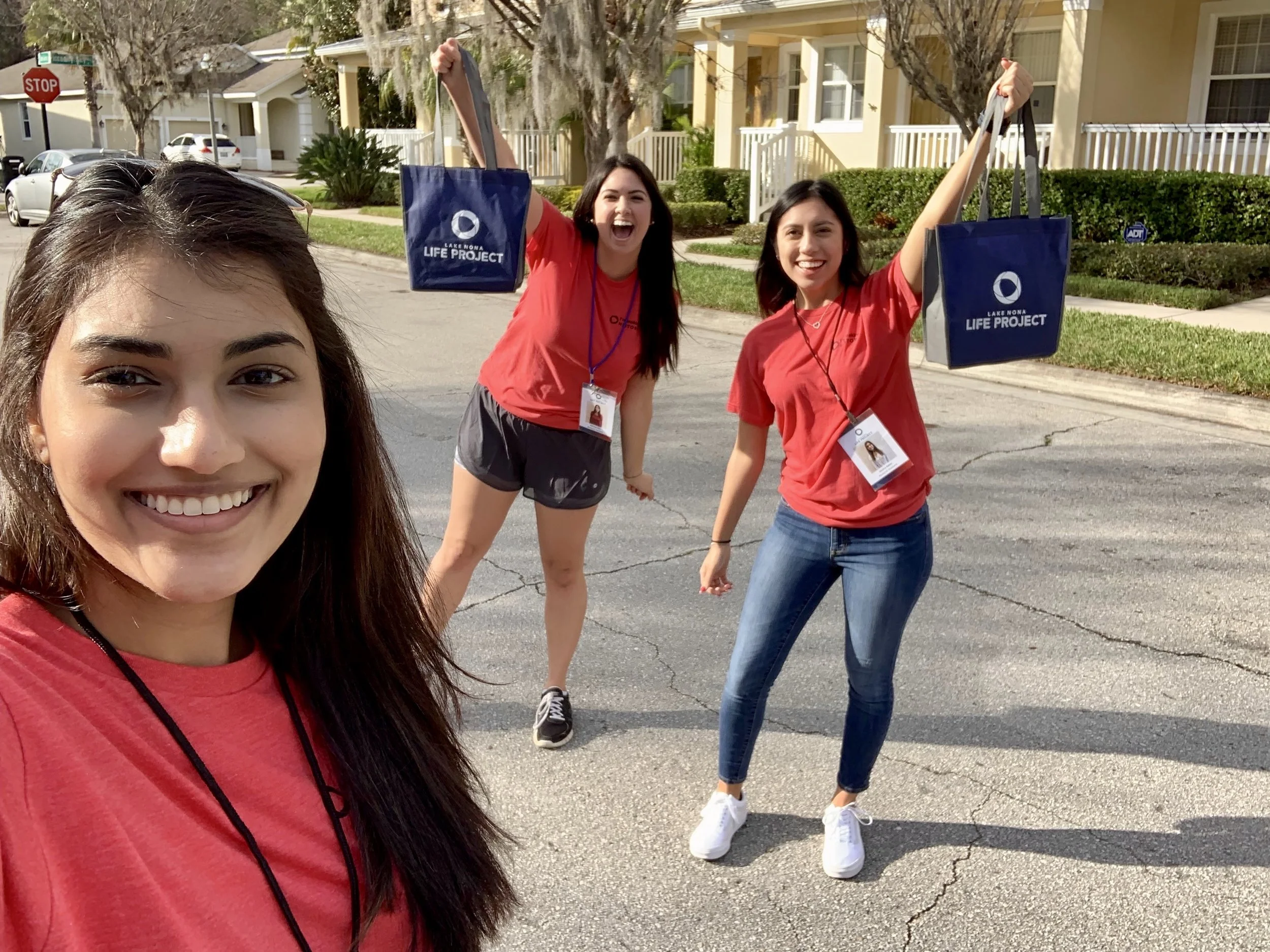 Life Project Research Assistants hand delivering Membership Kits to participants