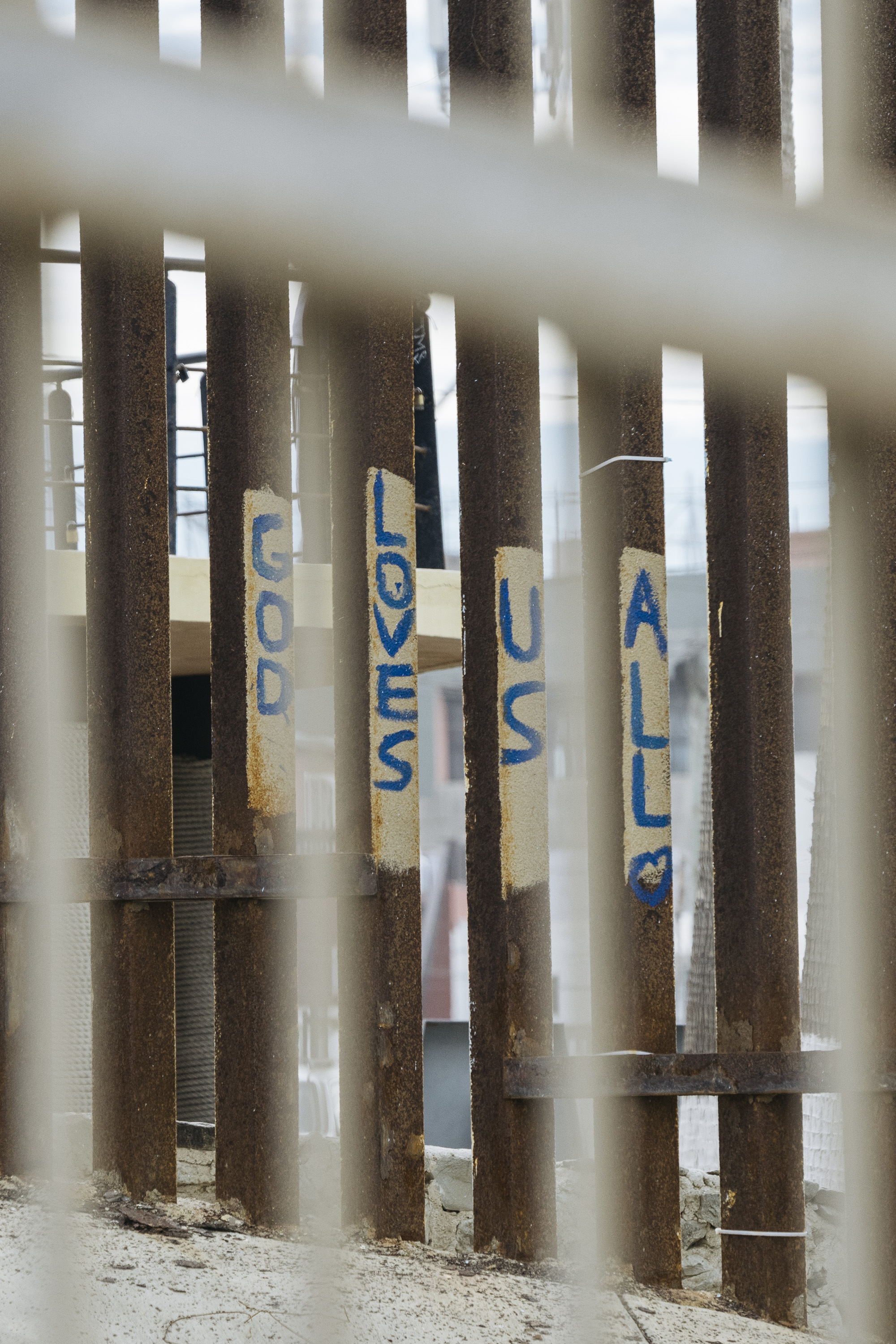  IMAGE CAPTION:  Protest graffiti along the San Diego - Tijuana border wall. 