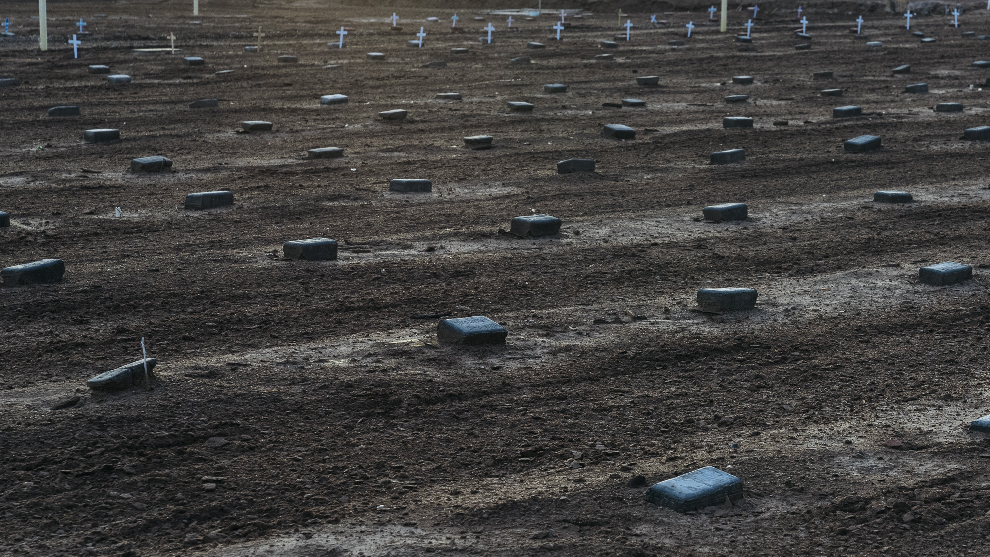  IMAGE CAPTION:  There are over 500 simply marked graves for deceased migrants in a dirt lot behind the Terrace Park Cemetery in Holtville, California. Most read Jane or John Doe.&nbsp;&nbsp; 