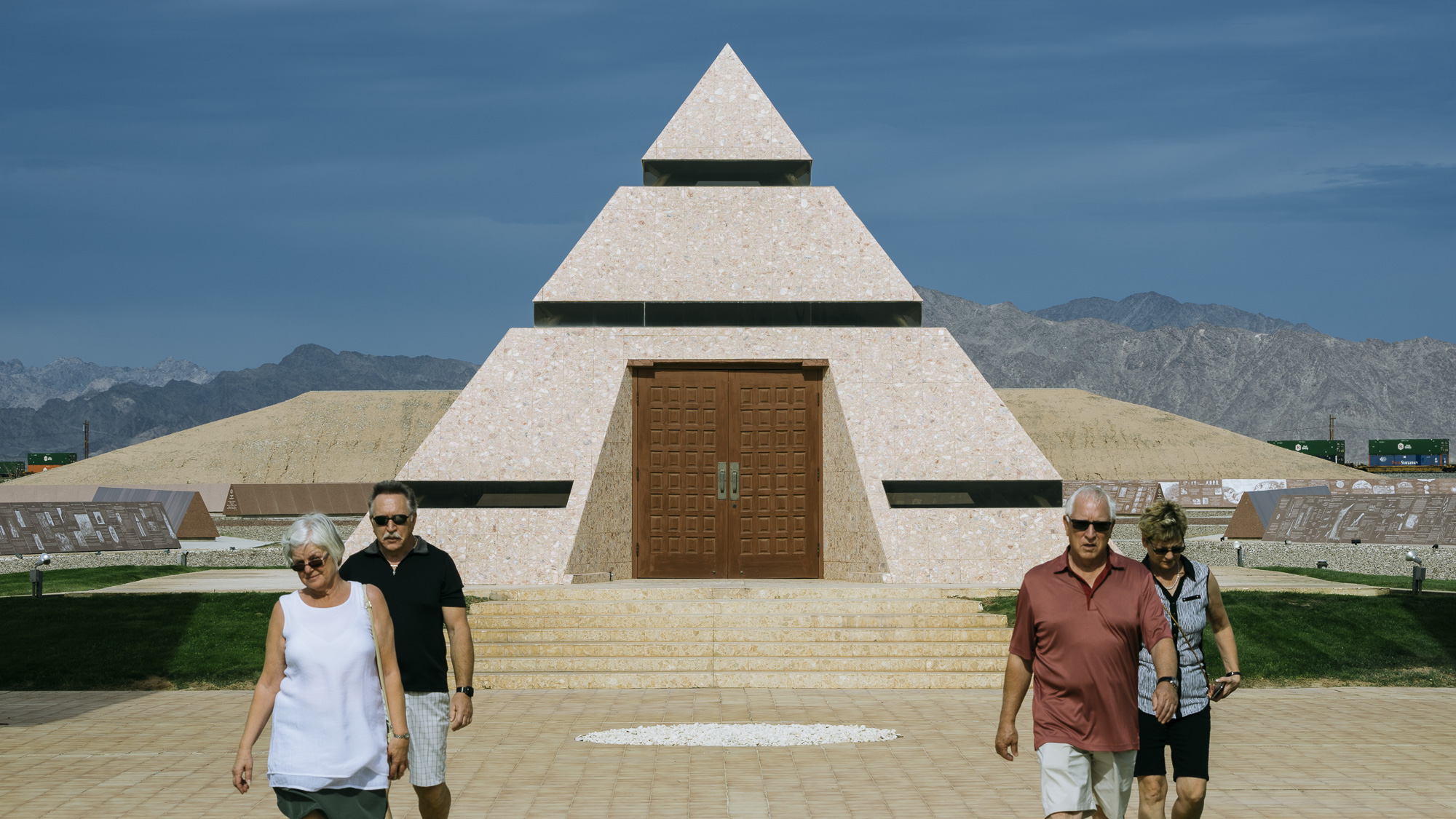 IMAGE CAPTION:  Canadian tourists at ‘The Official Center of the World’ a roadside attraction in Felicity, California, less than 5 miles away from the Andrade Port of Entry. 