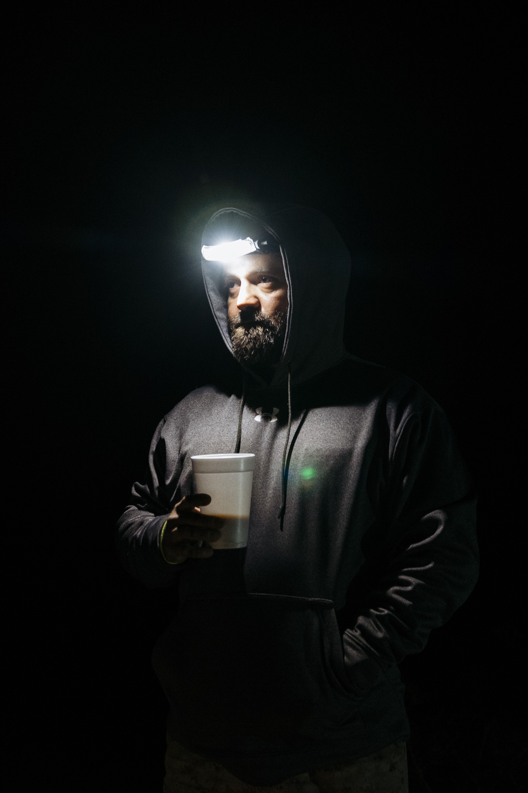  IMAGE CAPTION:  Aristotle Barbosa, a Marine Veteran, prepares at 4 AM for a day of searching the Sonoran Desert for deceased and lost migrants with Aguilas Del Desierto. “The landscape reminds me of Iraq, minus the cactus,” says Barbosa, who saw thr