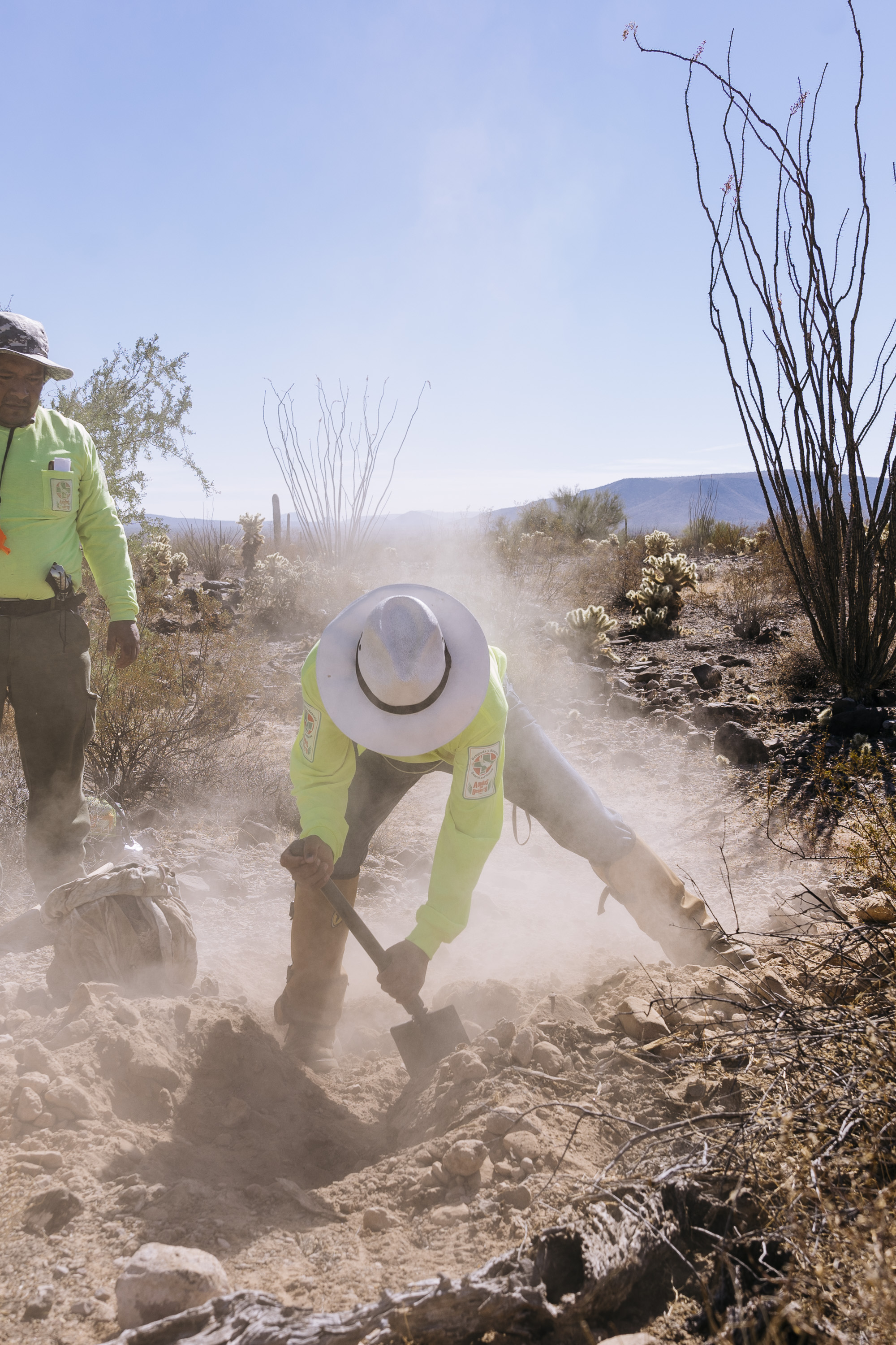  IMAGE CAPTION:  Members of Aguilas Del Desierto dig in the Sonoran Desert where they suspect the body of a migrant has been buried in a shallow grave. Most migrants who die crossing this treacherous desert have been left behind by the their guides a