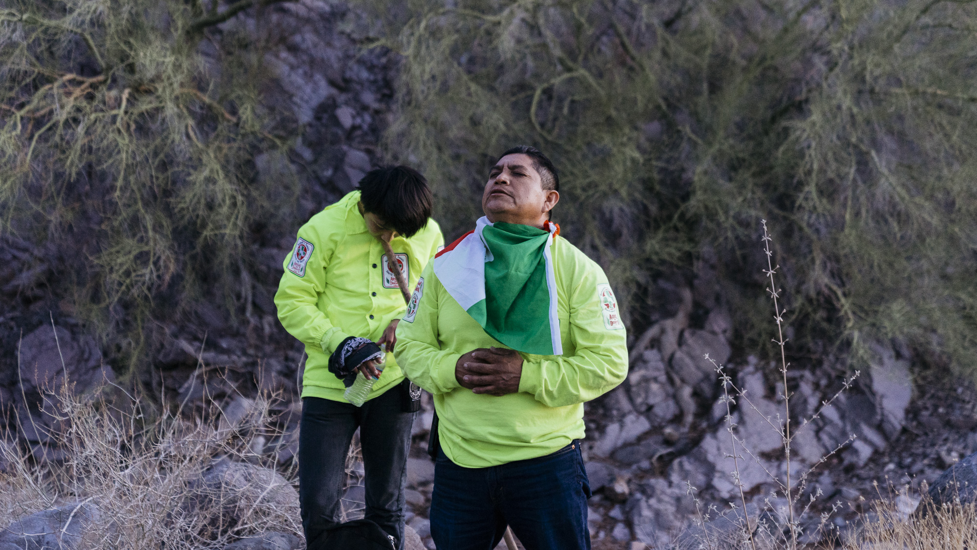  IMAGE CAPTION:  Angel Martinez (center) and 14 year old Jamie Martinez pray for their safety and the safe passage of all migrants in transit before beginning a sunrise to sunset desert search for lost and deceased migrants. &nbsp; 