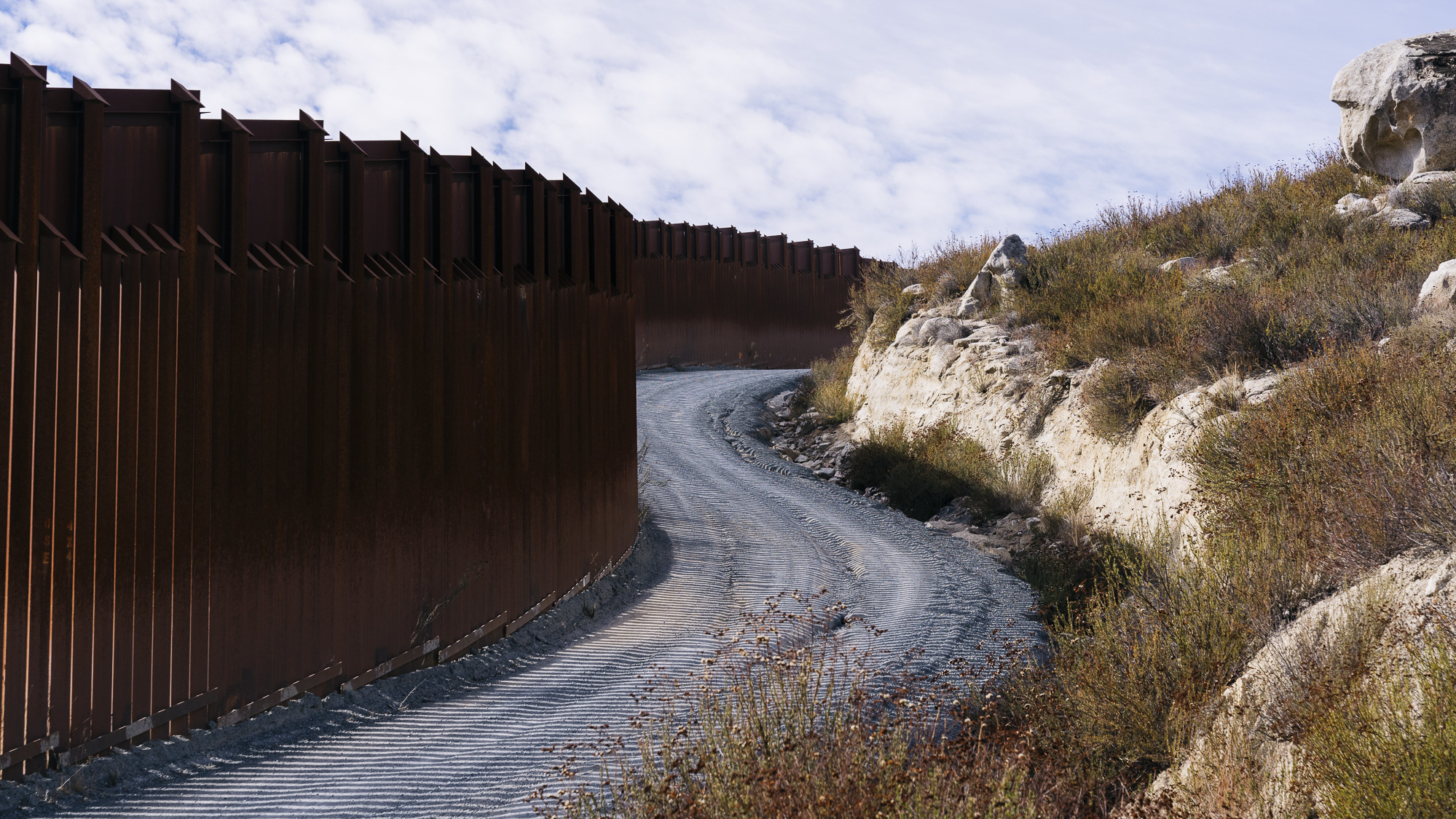   IMAGE CAPTION:   Border fence between the United Mexican States and the United States of America in Campo, California. There are nearly 700 miles of border fence already built along the 1,954 mile border between the two countries. 