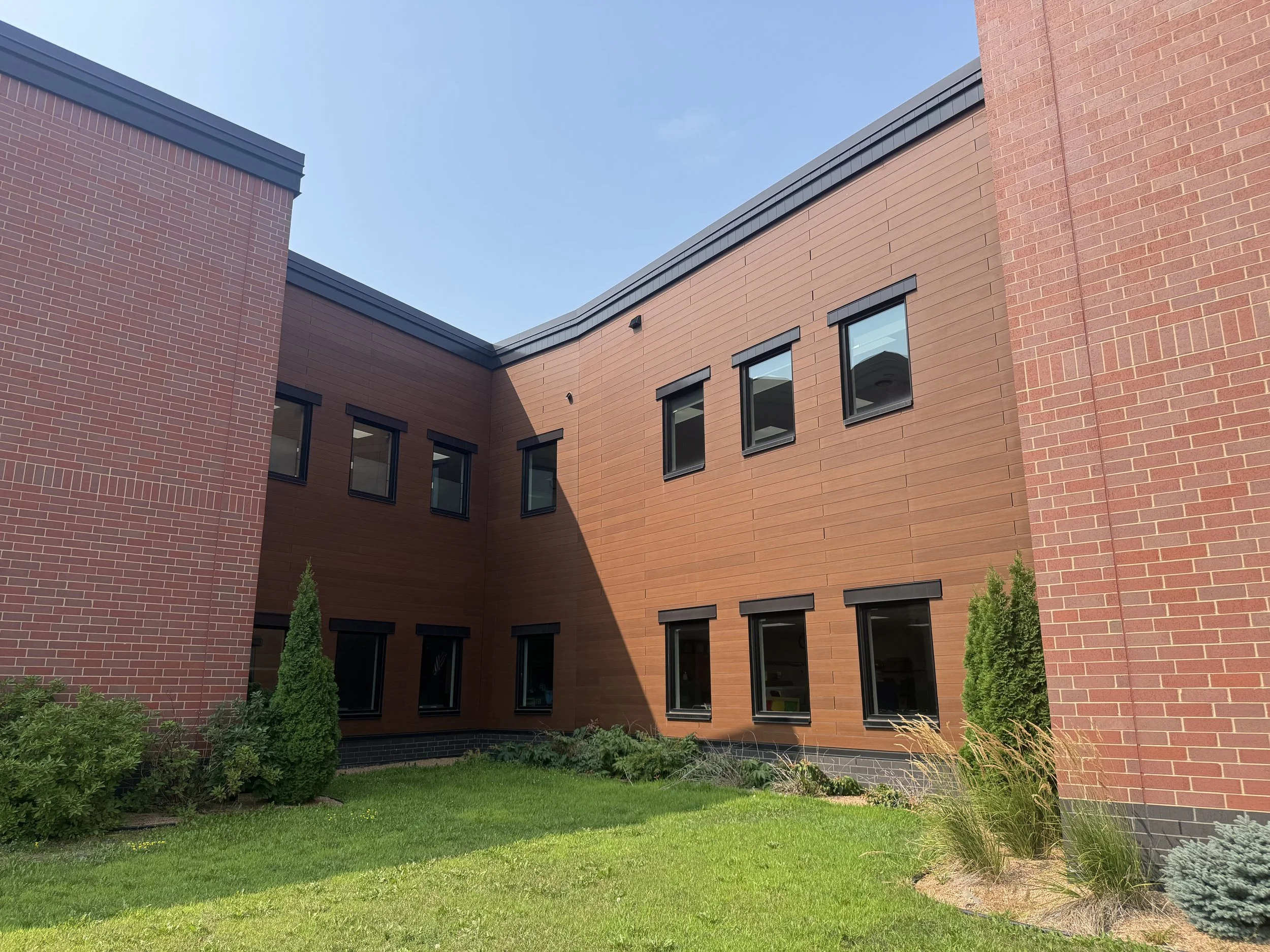 Wood grain phenolic composite and architectural single skin panels installed at Hamilton Ridge Elementary School in Savage, MN.