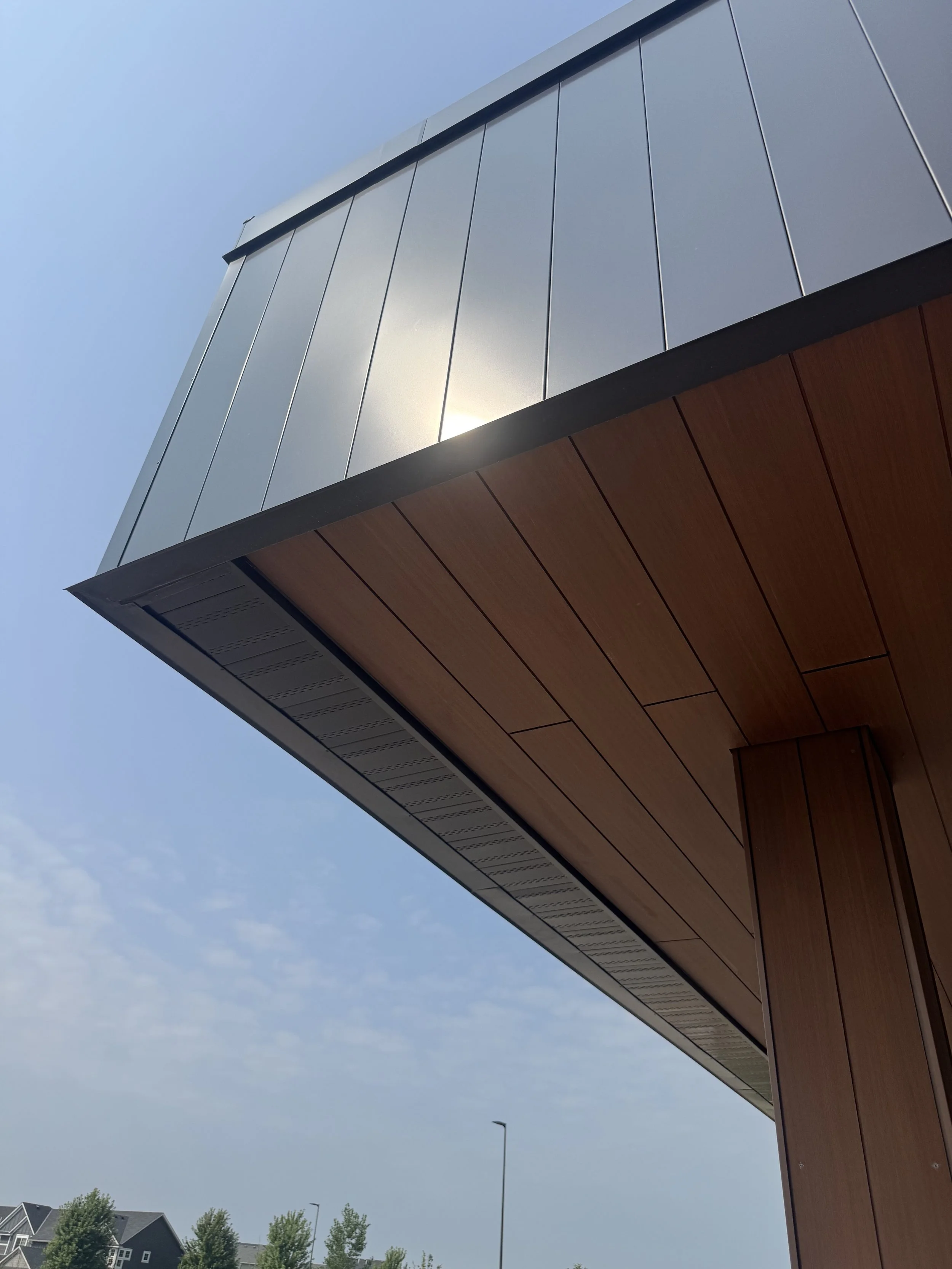 Wood grain phenolic composite and architectural single skin panels installed at Hamilton Ridge Elementary School in Savage, MN.