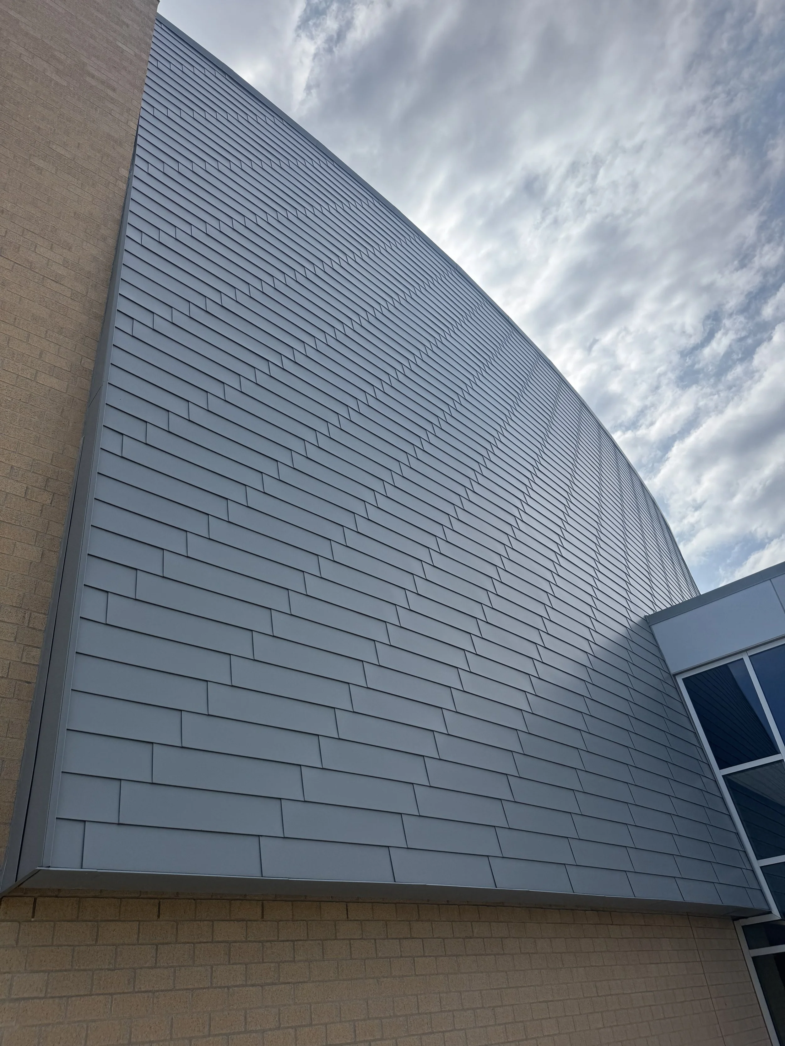 Flat lock panels installed at the auditorium addition at Zimmerman Middle & High School in Zimmerman, MN.