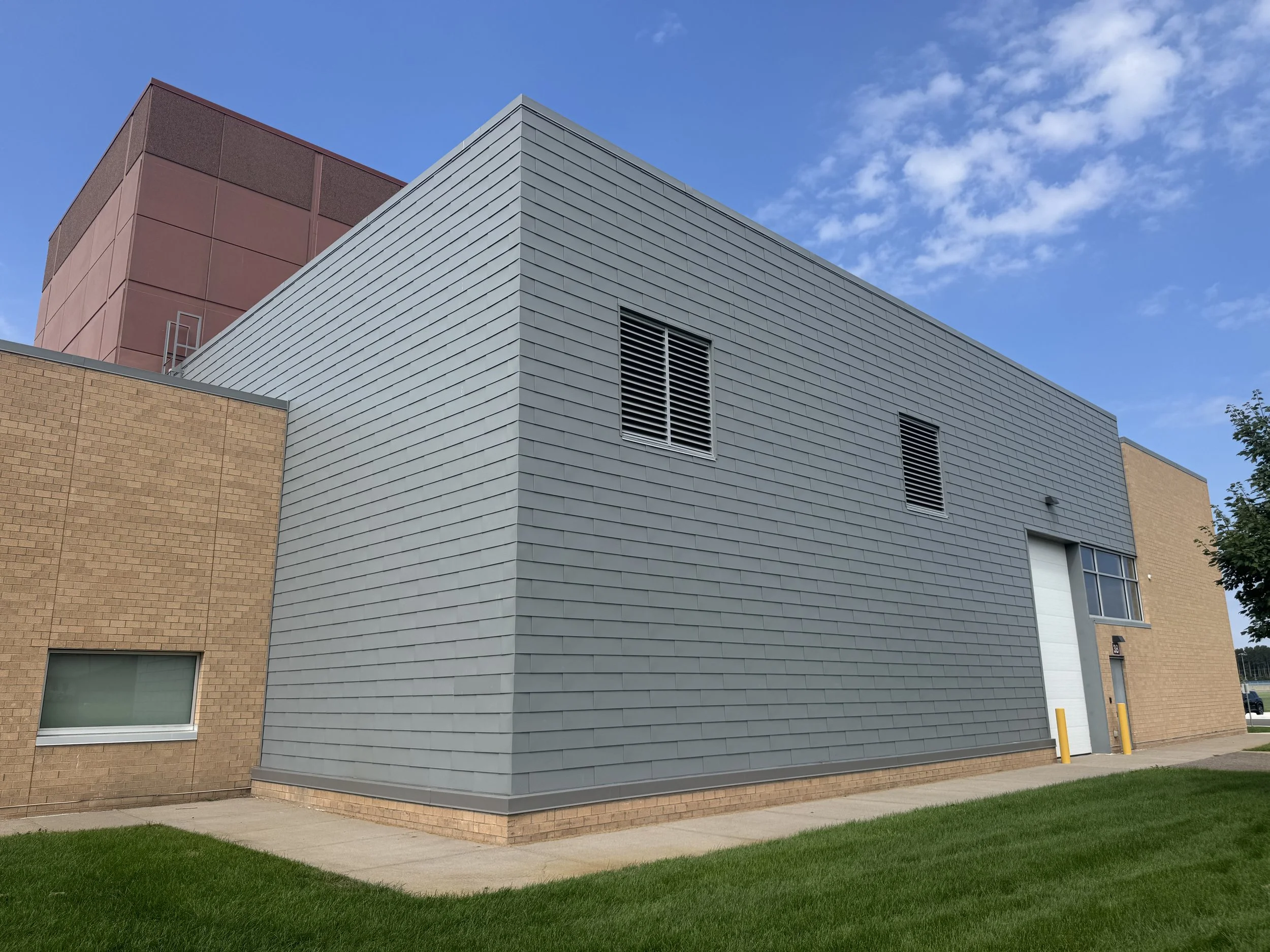 Flat lock panels installed at the auditorium addition at Zimmerman Middle & High School in Zimmerman, MN.