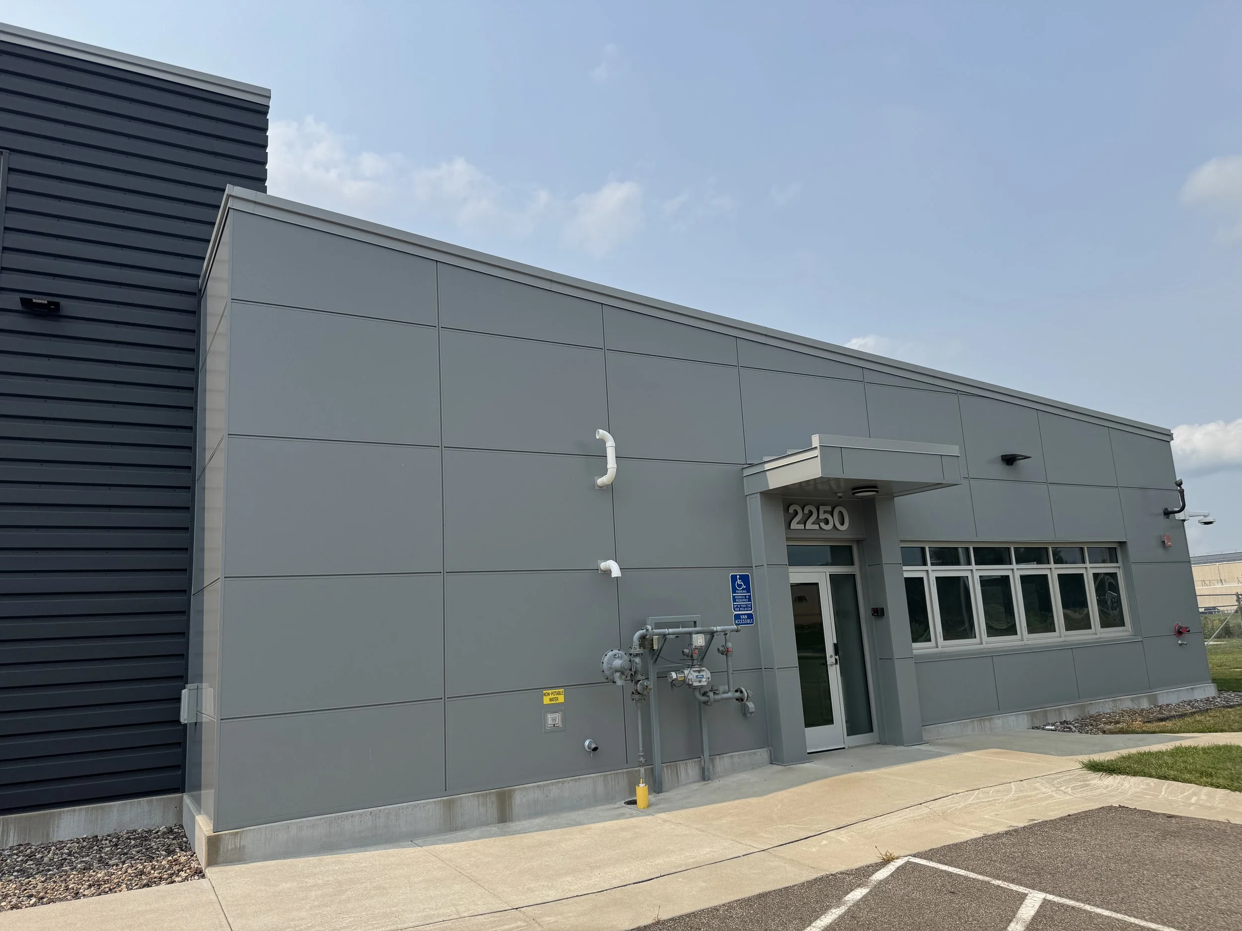 Architectural single skin and aluminum composite panels installed at MnDOT Truck Station in Northfield, MN