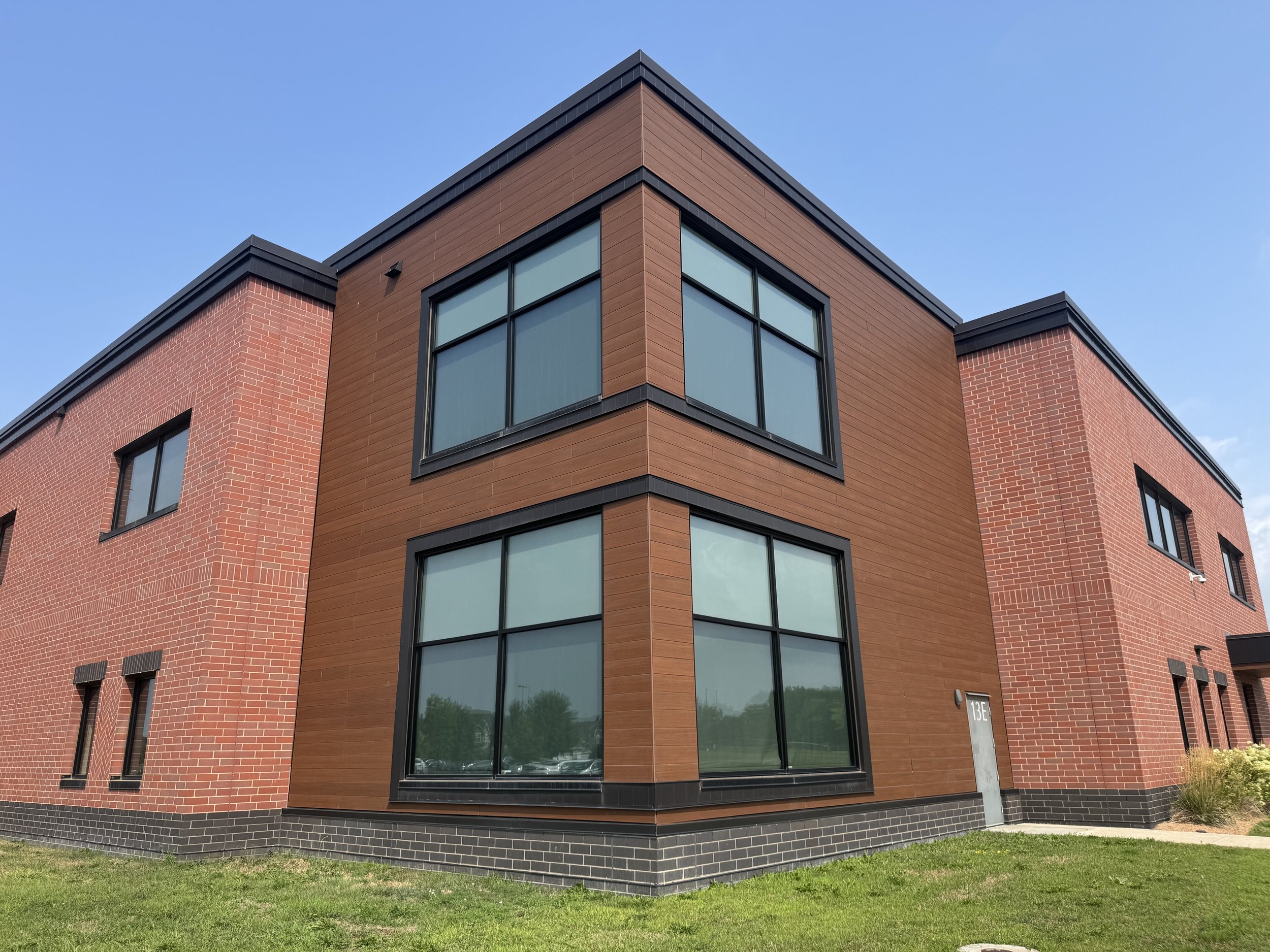 Wood grain phenolic composite and architectural single skin panels installed at Hamilton Ridge Elementary School in Savage, MN.