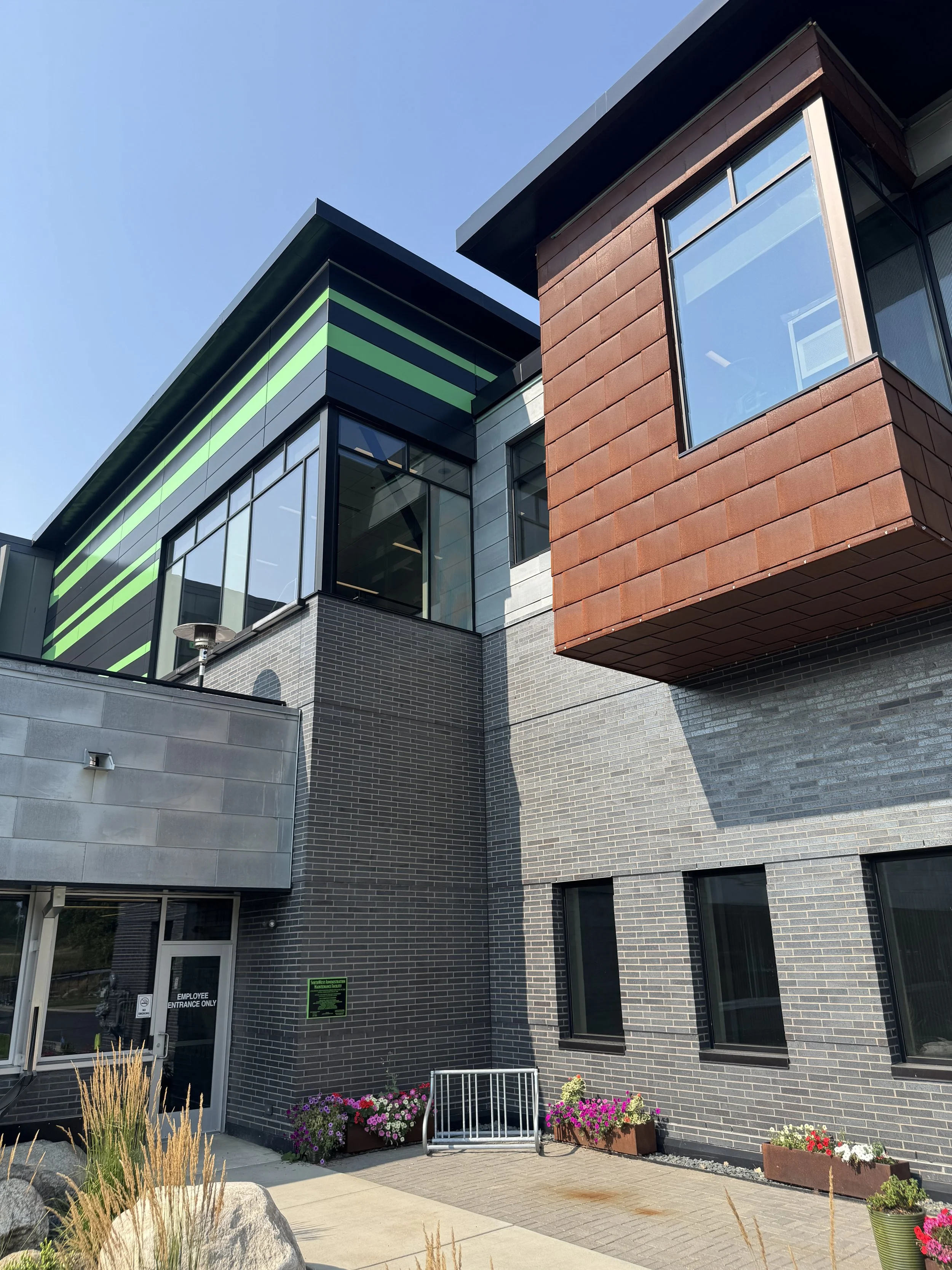 Zinc & Weathered Steel Flat Lock and aluminum plate panels installed at the SW Transit Leonard L Simich Maintenance & Administrative Facility in Eden Prairie, MN.