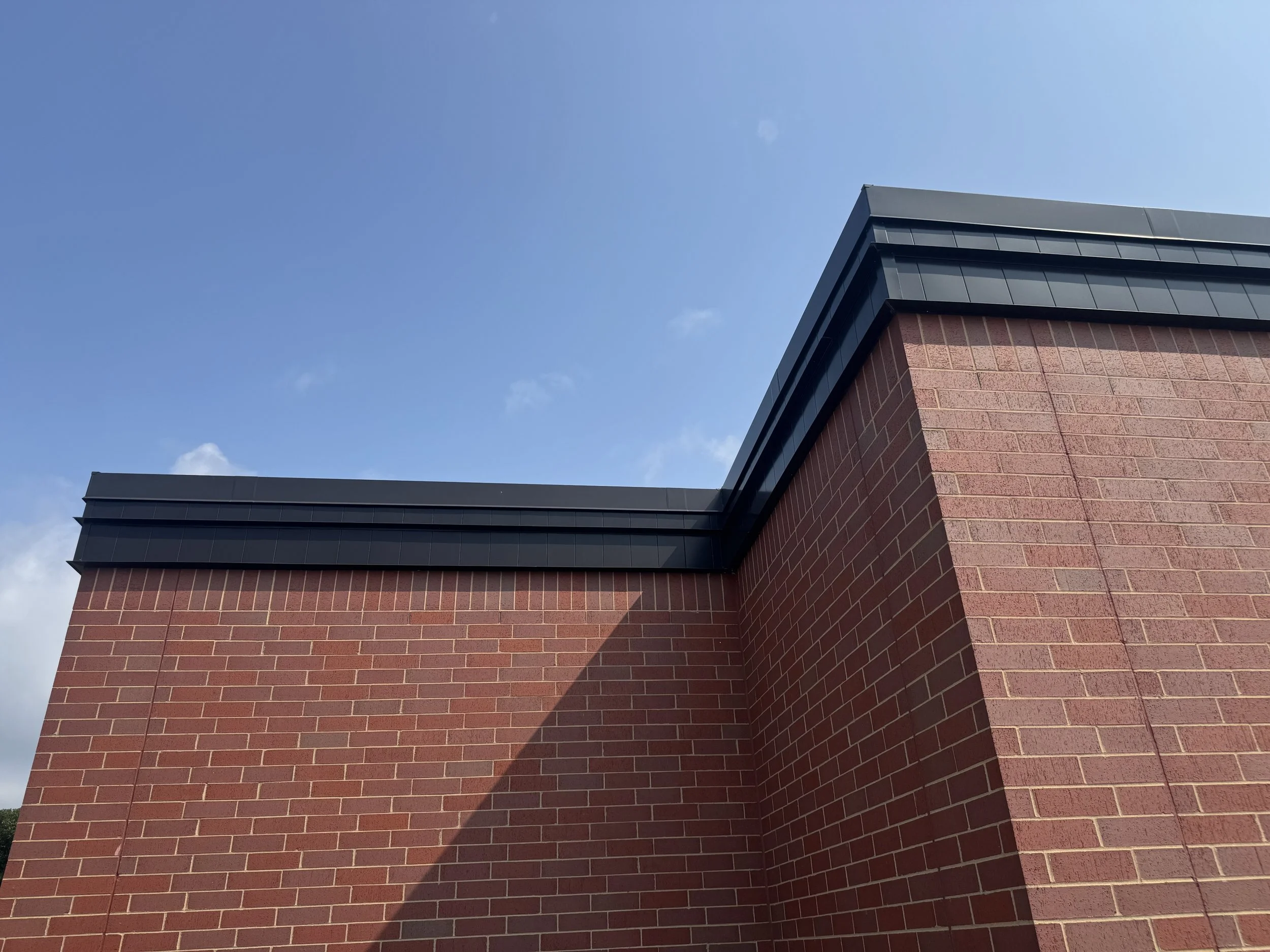 Wood grain phenolic composite and architectural single skin panels installed at Hamilton Ridge Elementary School in Savage, MN.