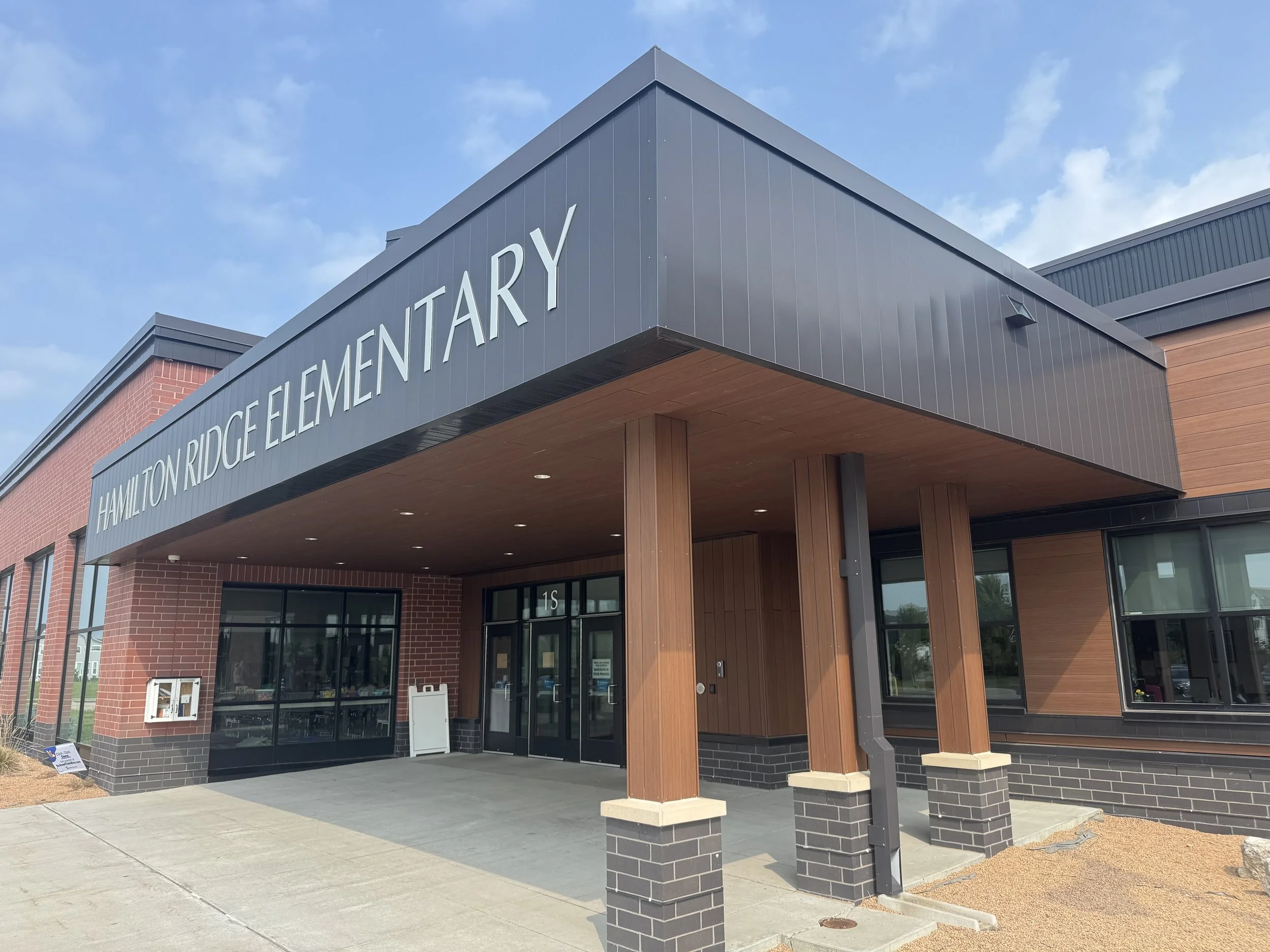 Wood grain phenolic composite and architectural single skin panels installed at Hamilton Ridge Elementary School in Savage, MN.