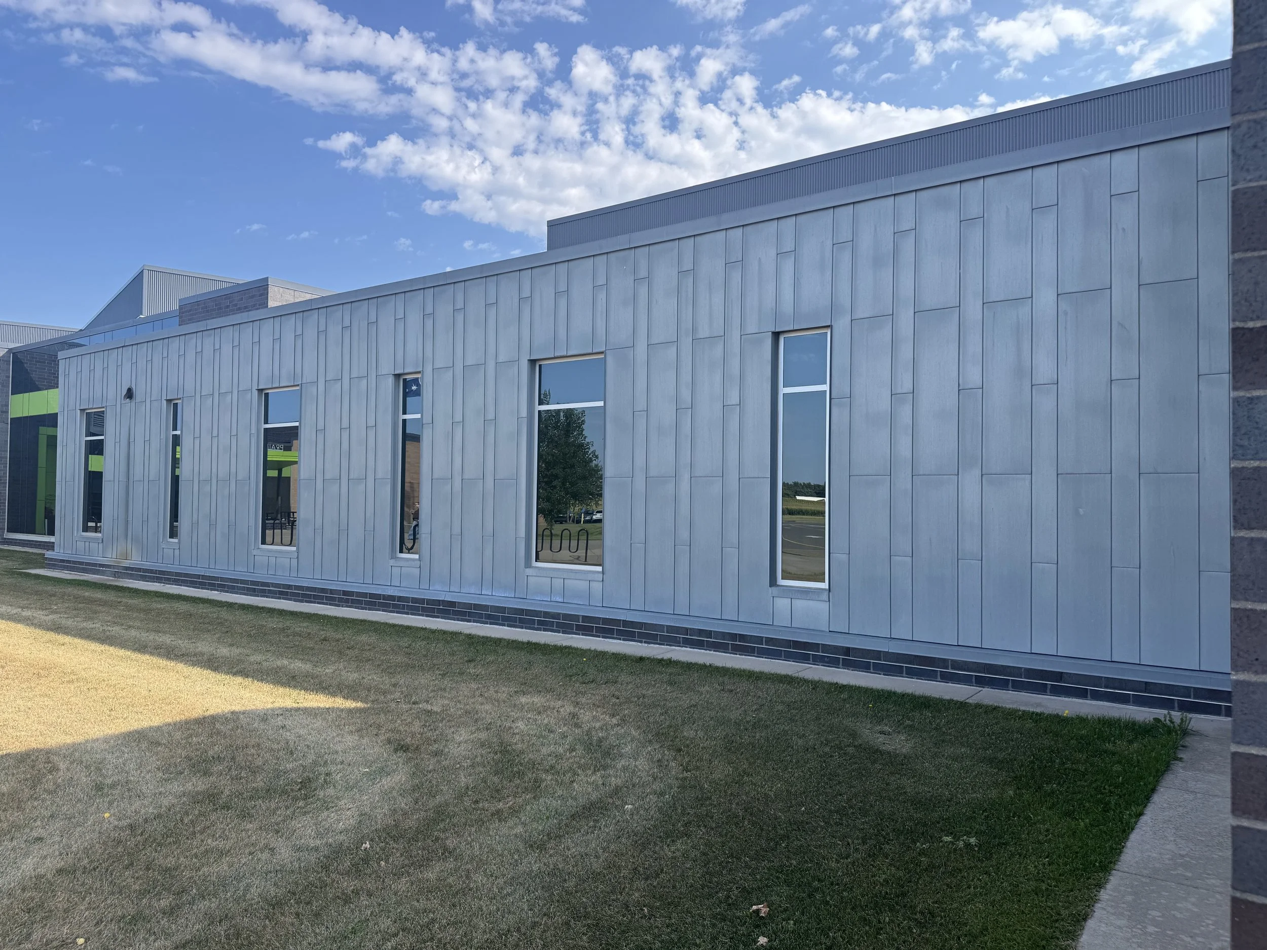 Zinc flat lock and architectural single skin panels installed at Prairie View Elementary School in Otsego, MN.