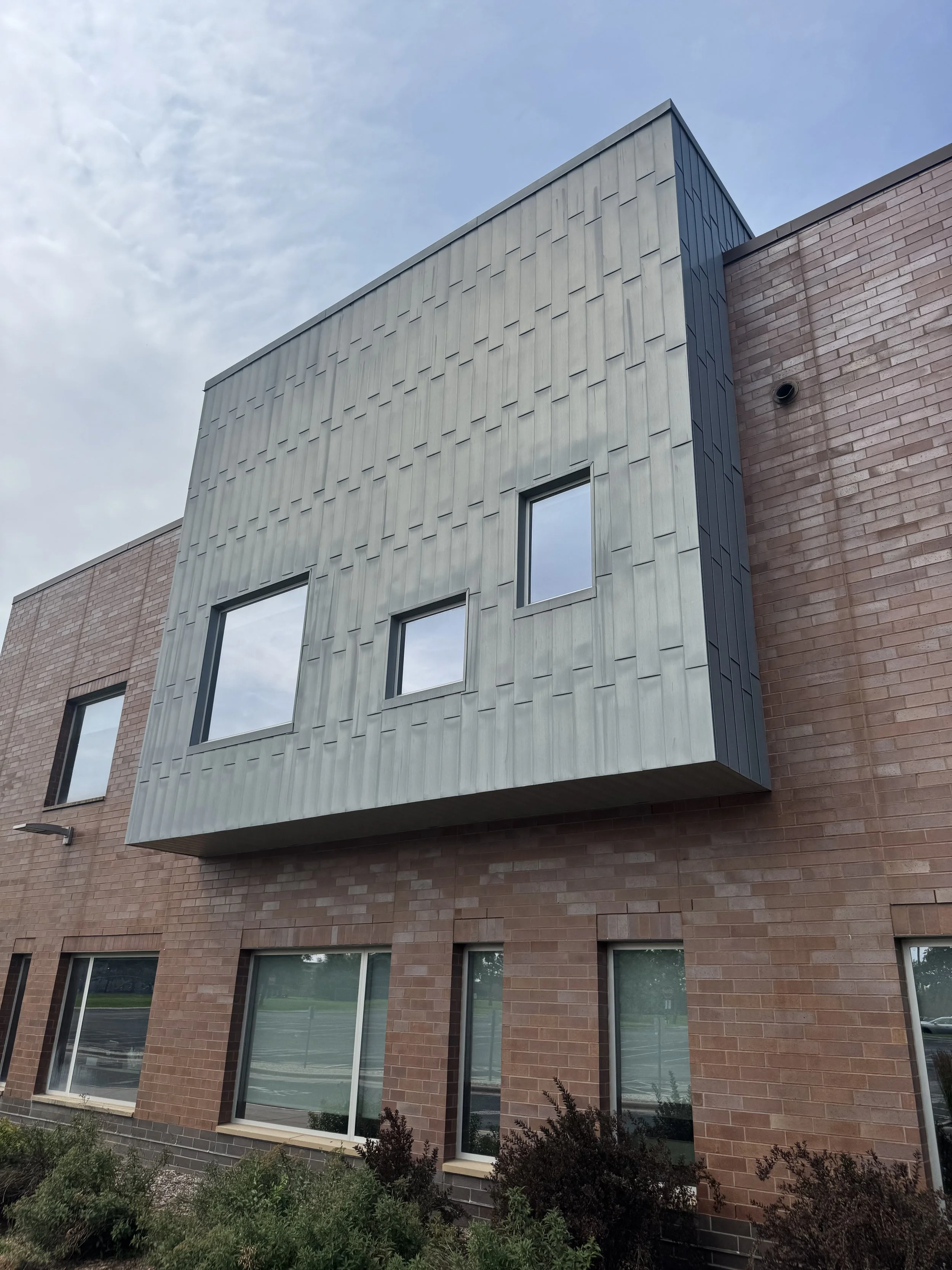 Zinc flat lock panels installed at Dakota Valley Learning Center in Rosemount, MN.