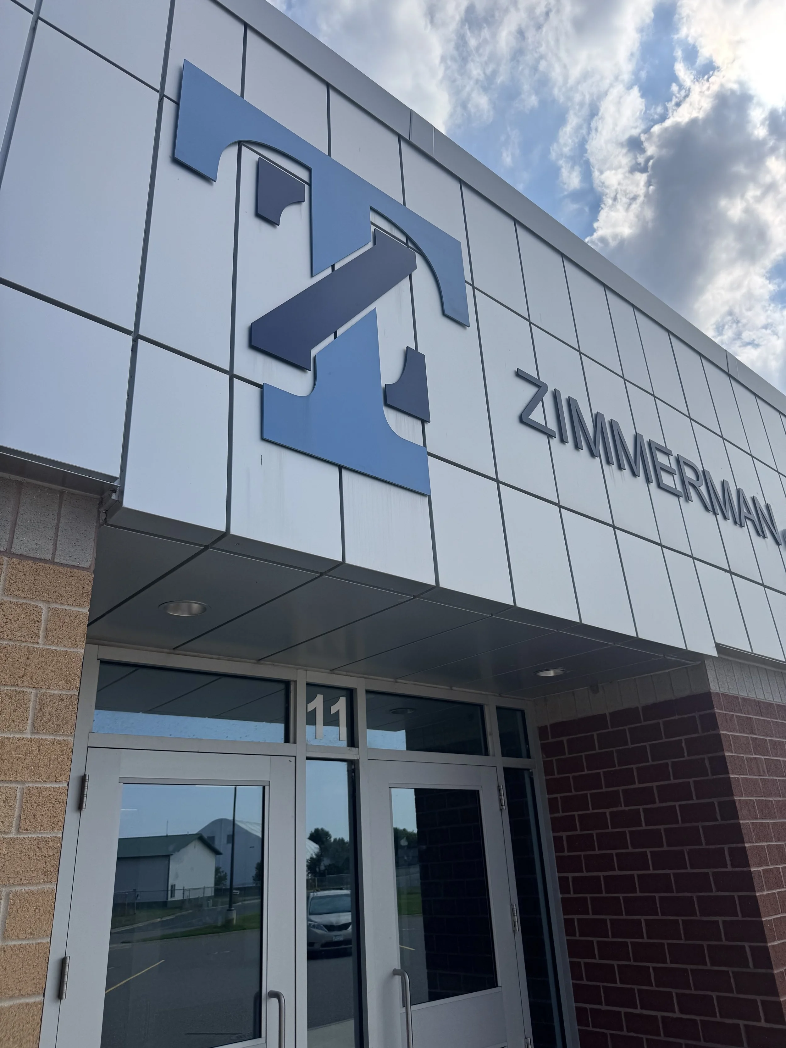 Aluminum plate panels installed at the gymnasium addition at Zimmerman Middle & High School in Zimmerman, MN.