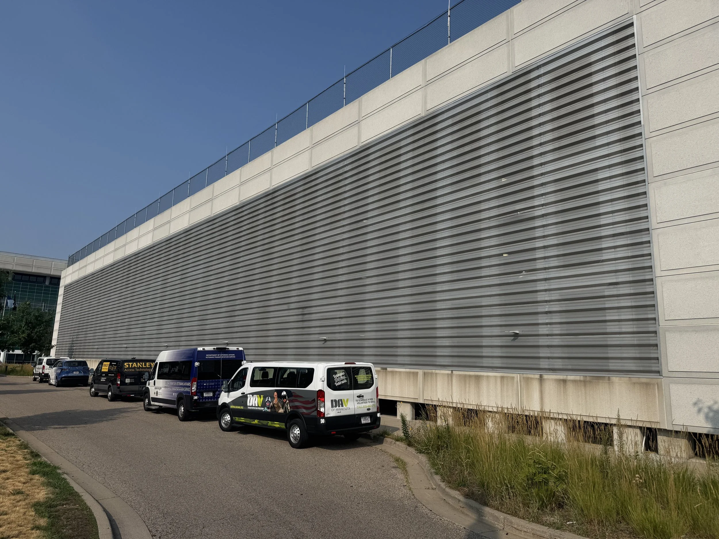 Exposed fastener perforated architectural single skin panels installed at the V.A. Medical Center Parking Ramp in Minneapolis, MN.