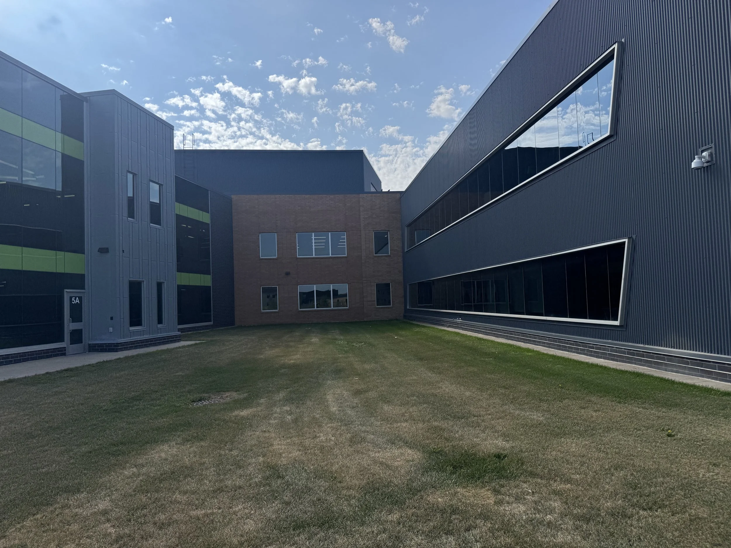 Zinc flat lock and architectural single skin panels installed at Prairie View Elementary School in Otsego, MN.