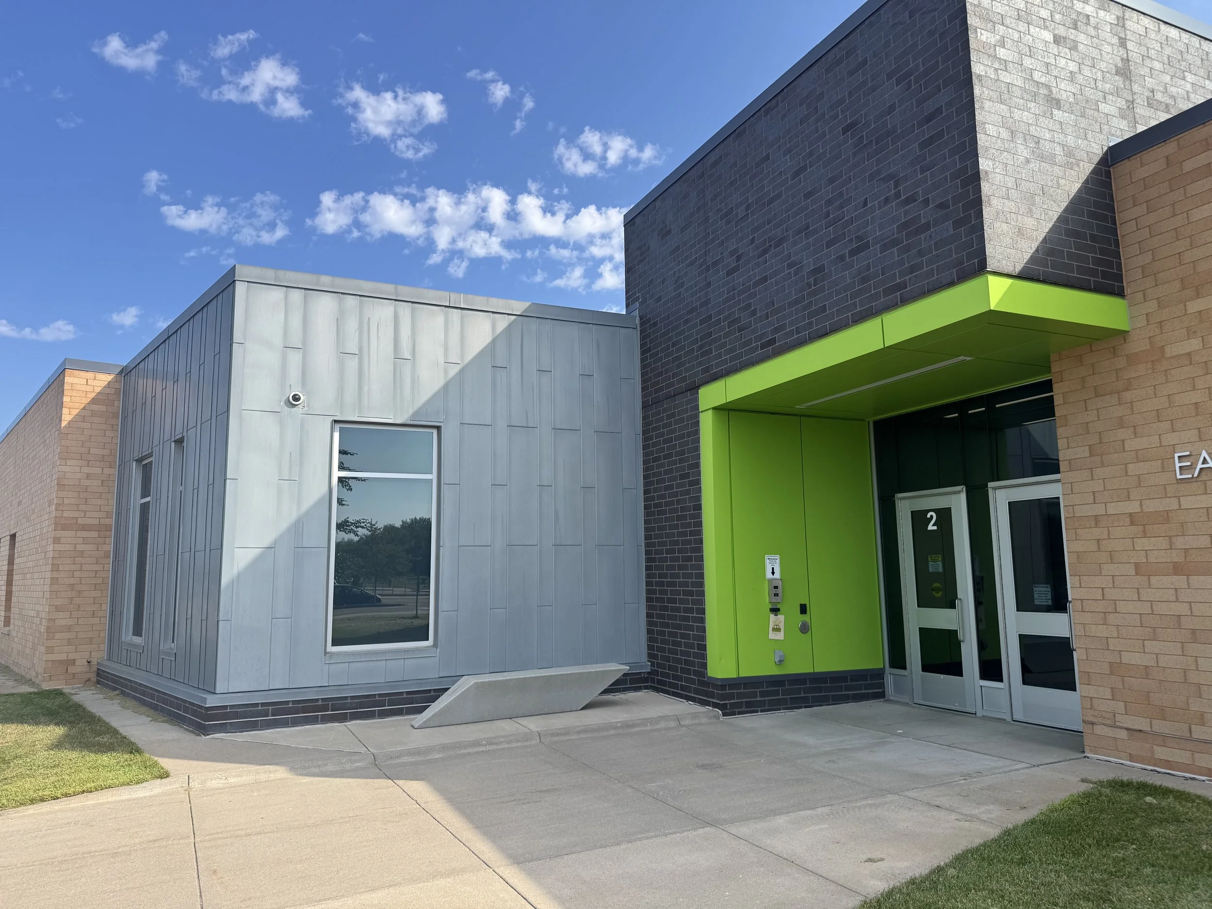 Aluminum composite, zinc flat lock and architectural single skin panels installed at Prairie View Elementary School in Otsego, MN.