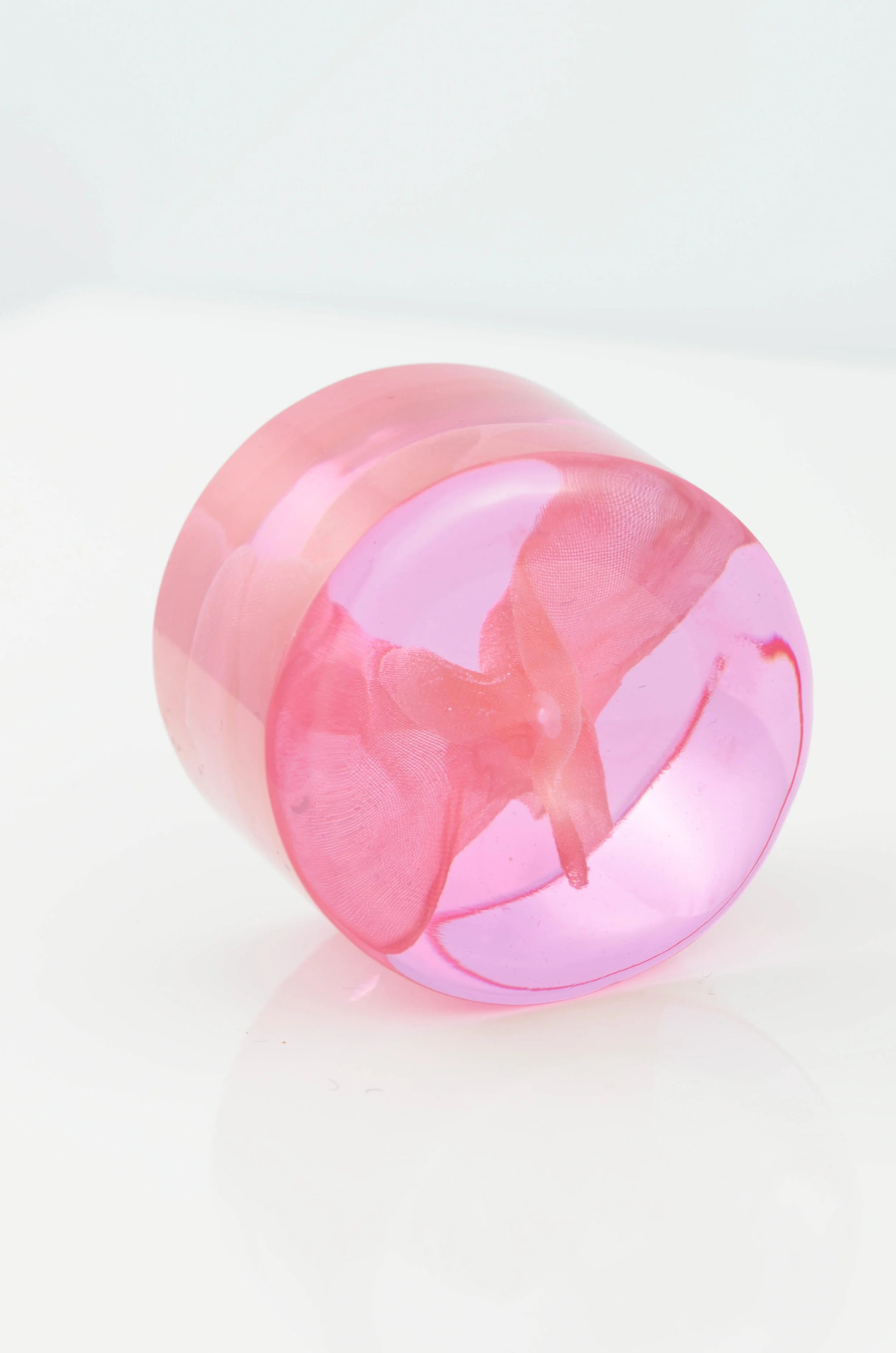 Flowing copper mesh inside round in pink Waken Glass